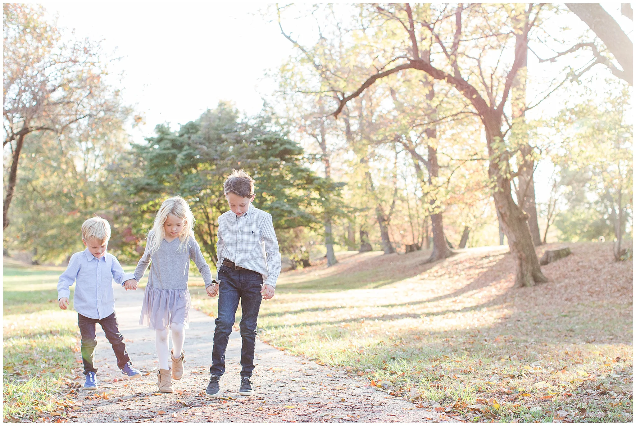 family walking in fall day for photo session