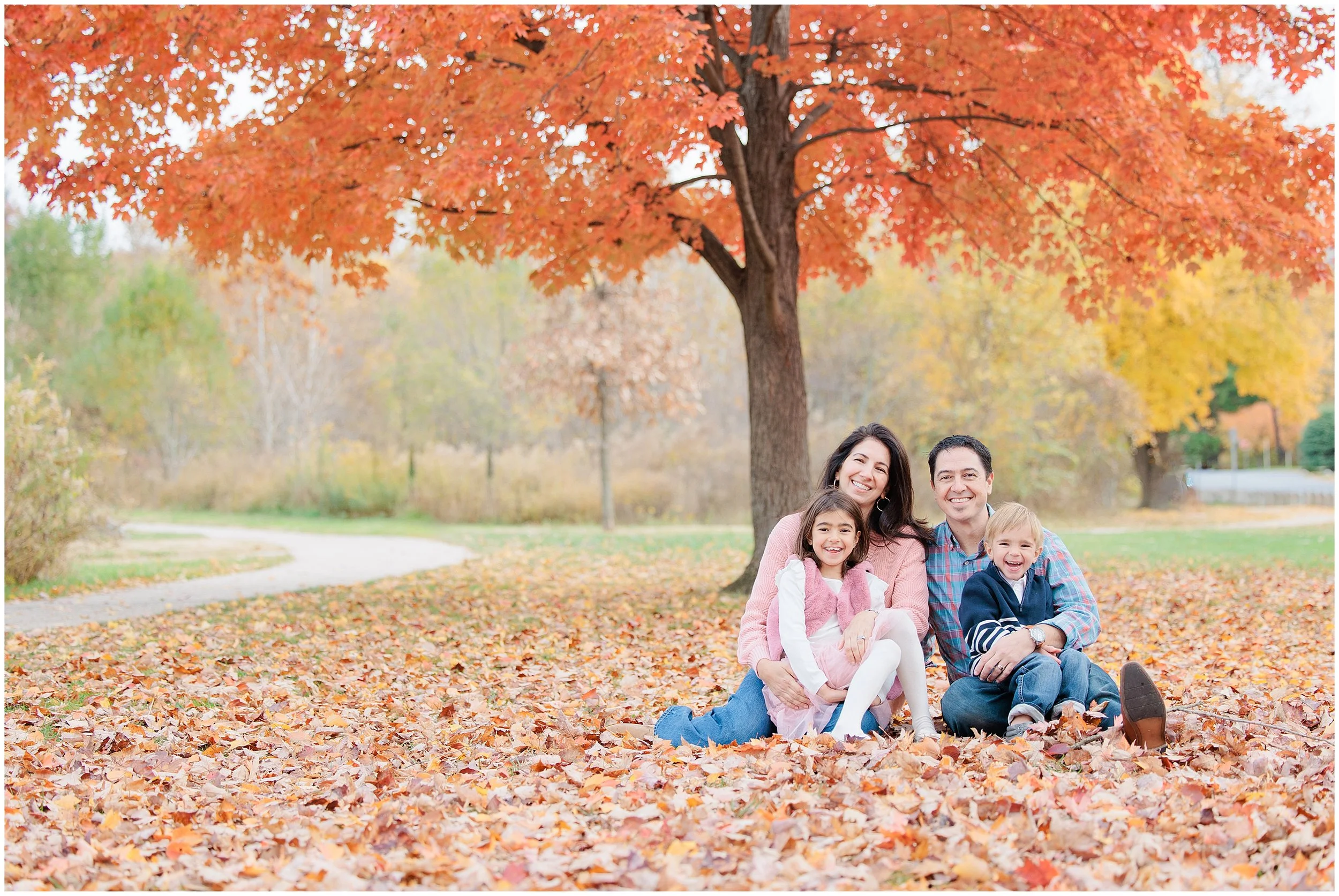 Family interacting naturally during photo session at Evans Park Silver Spring