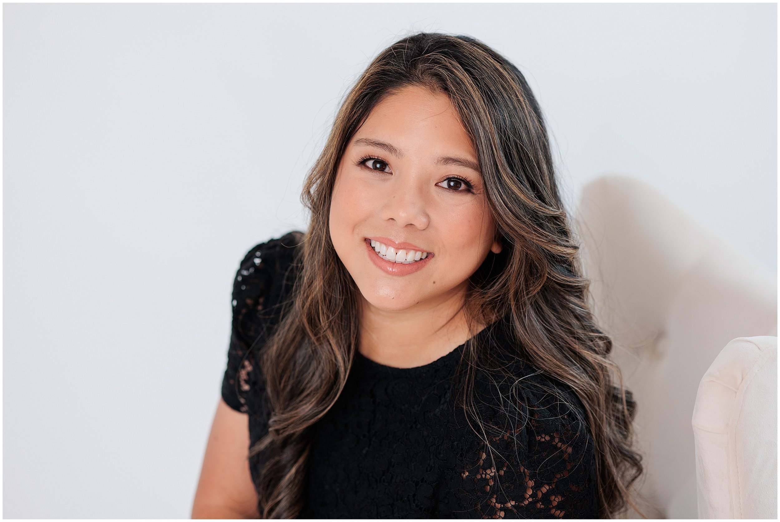 asian woman smiling in studio