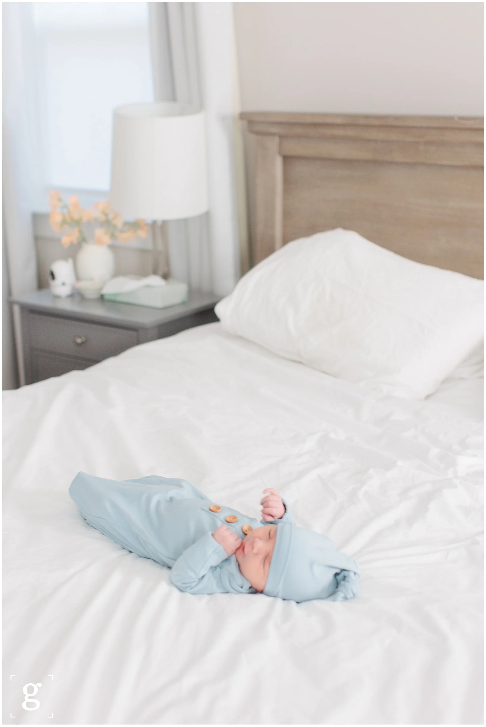 baby boy on bed during lifestyle newborn session the dmv