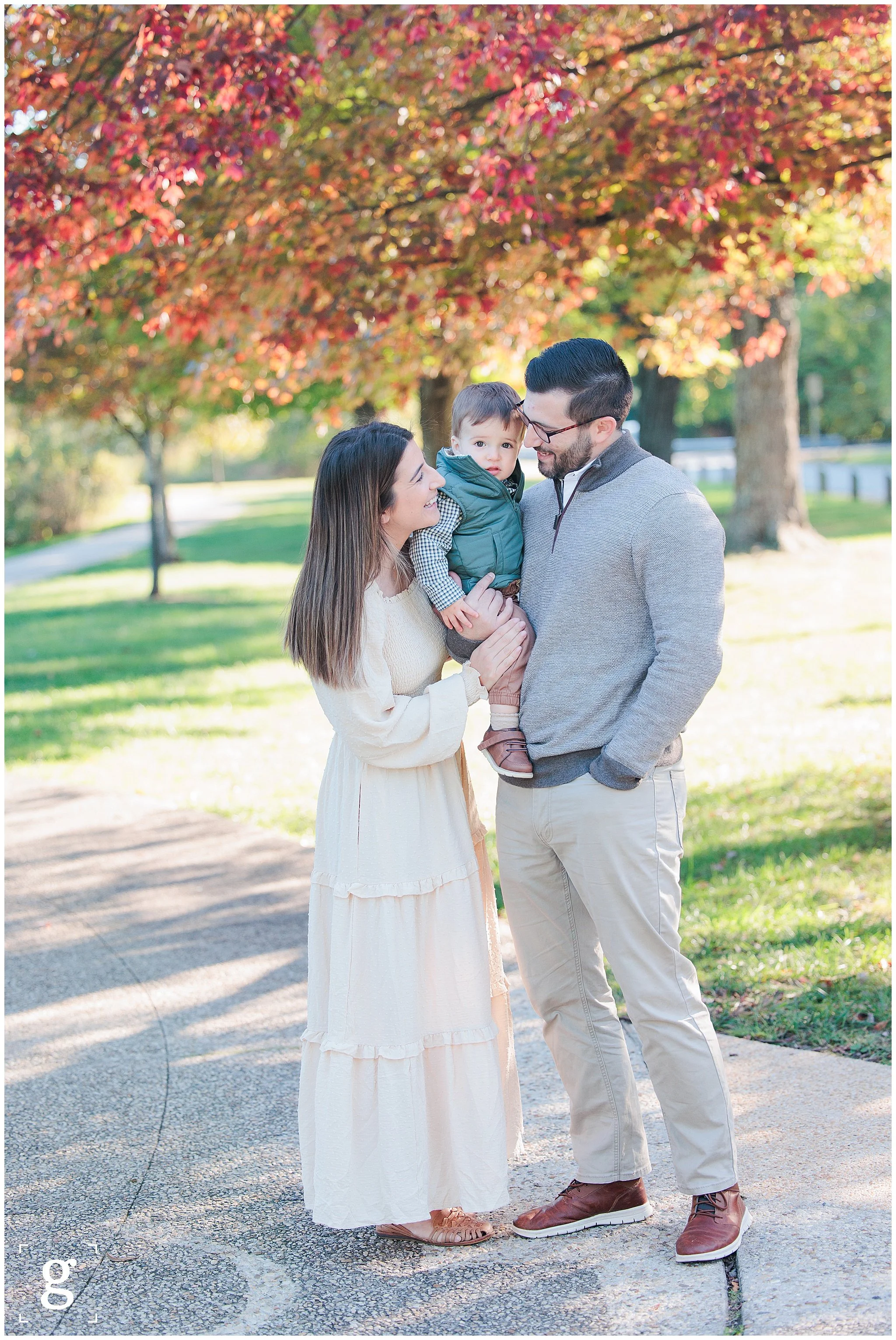 family standing under fall tree for family session in Silver Spring MD