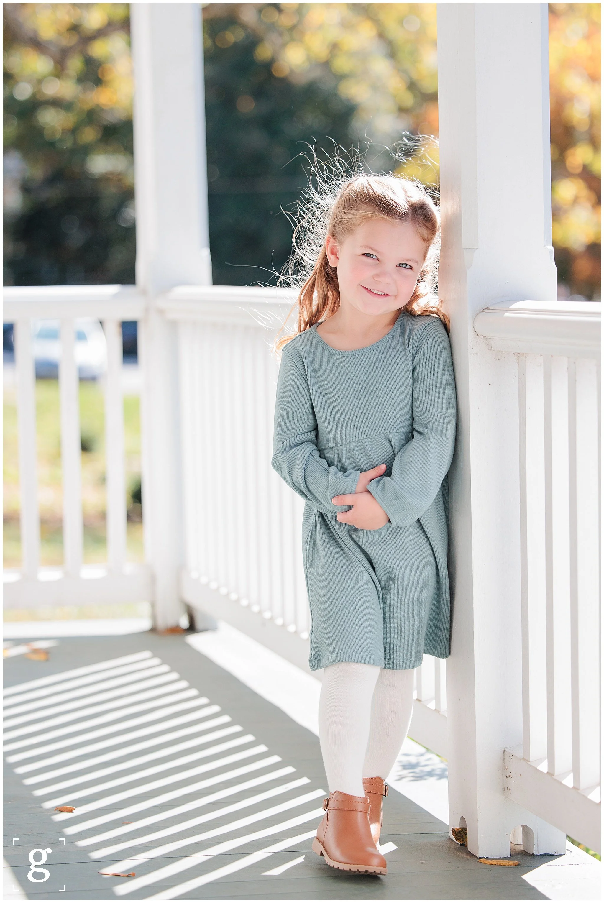 Young girl smiling during a spring family photo session in Arlington VA