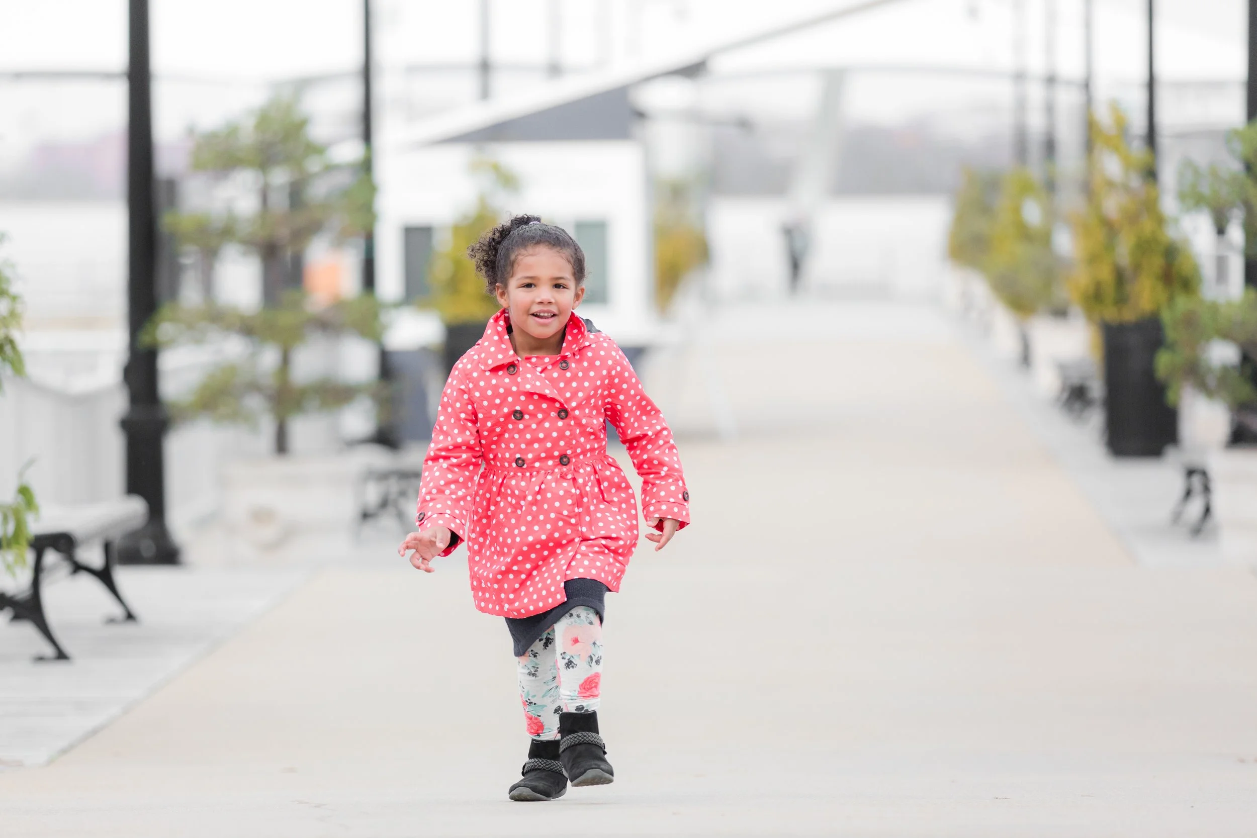 little girl running down the pier during family weekend at National Harbor