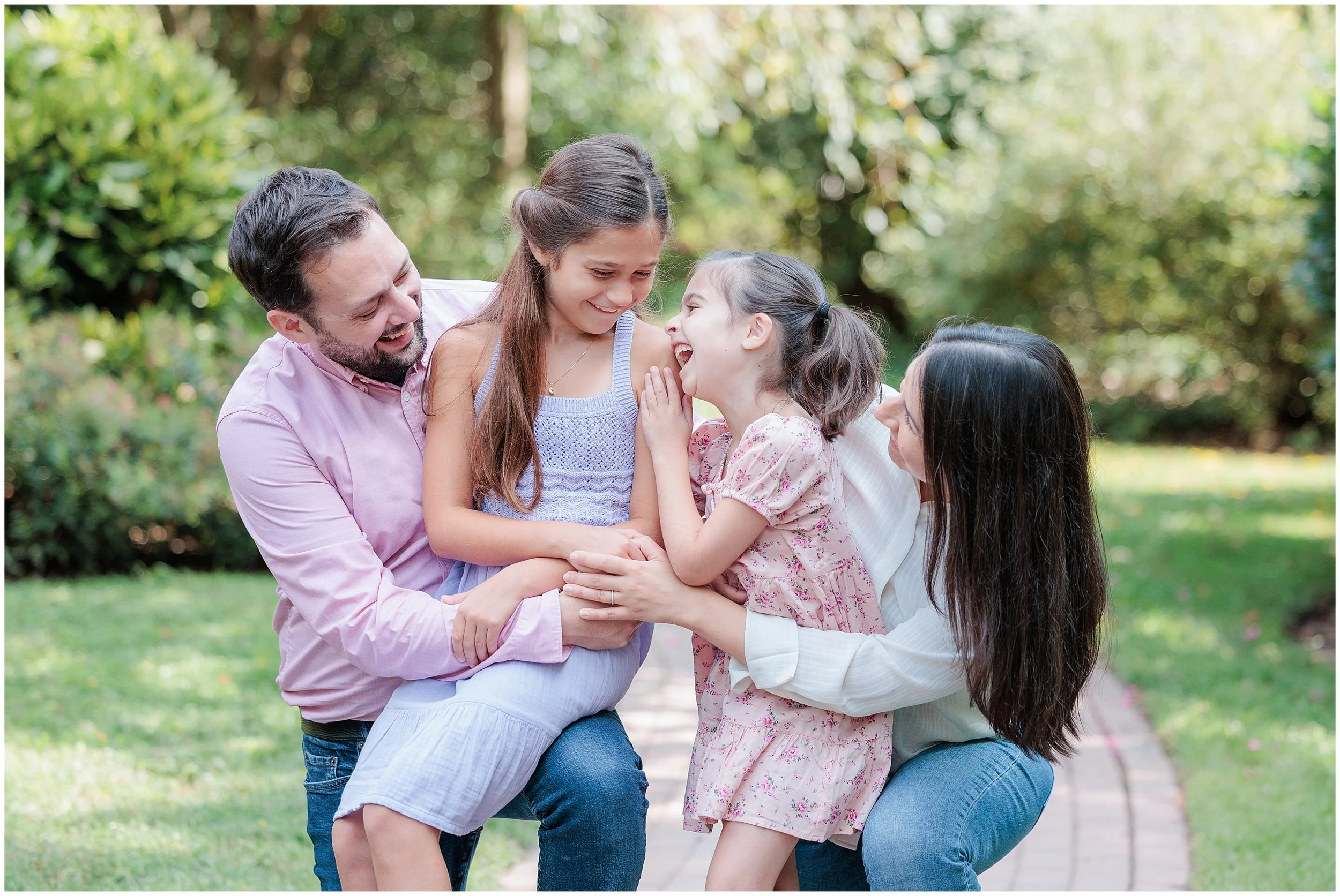 family laughing and cuddling during family maryland photo session in kensington park