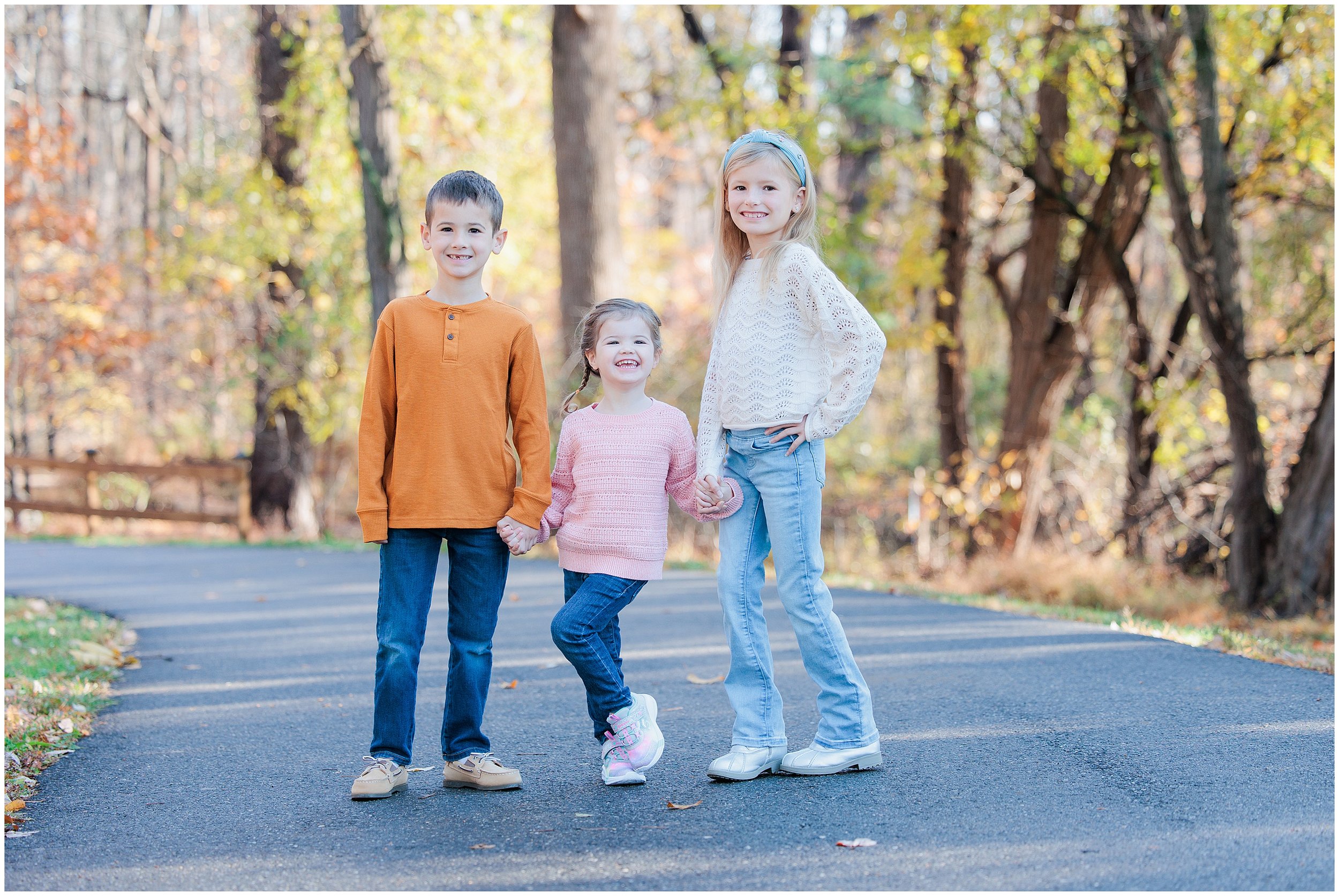 Three kids in Fall foliage at Wheaton Regional Park