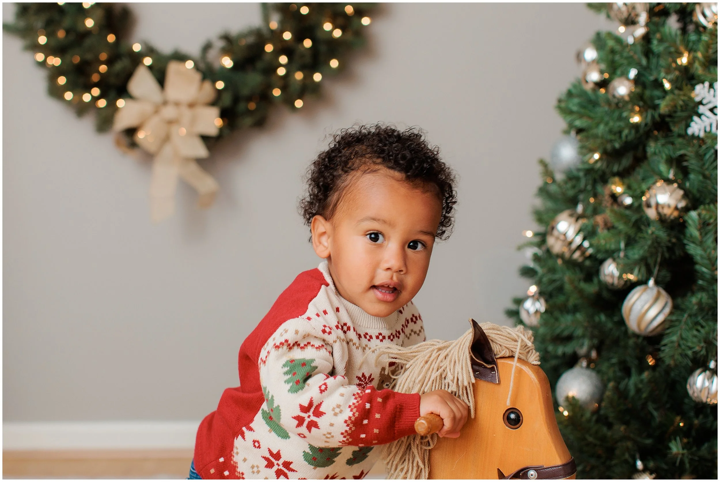 Toddler smiling during Christmas family photography session