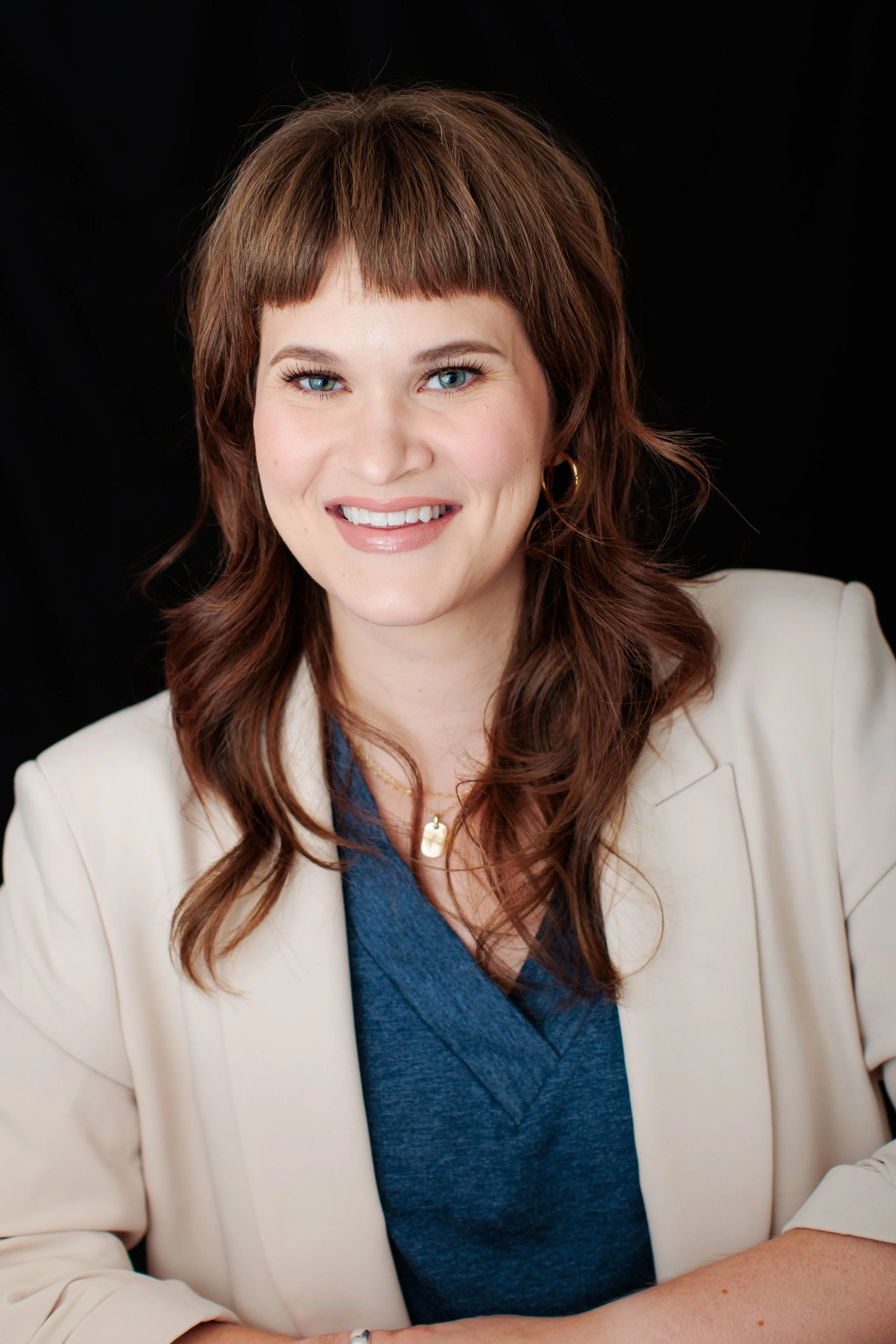  Professional headshot of a small business owner in a cream blazer photographed in my Silver Spring MD studio. 