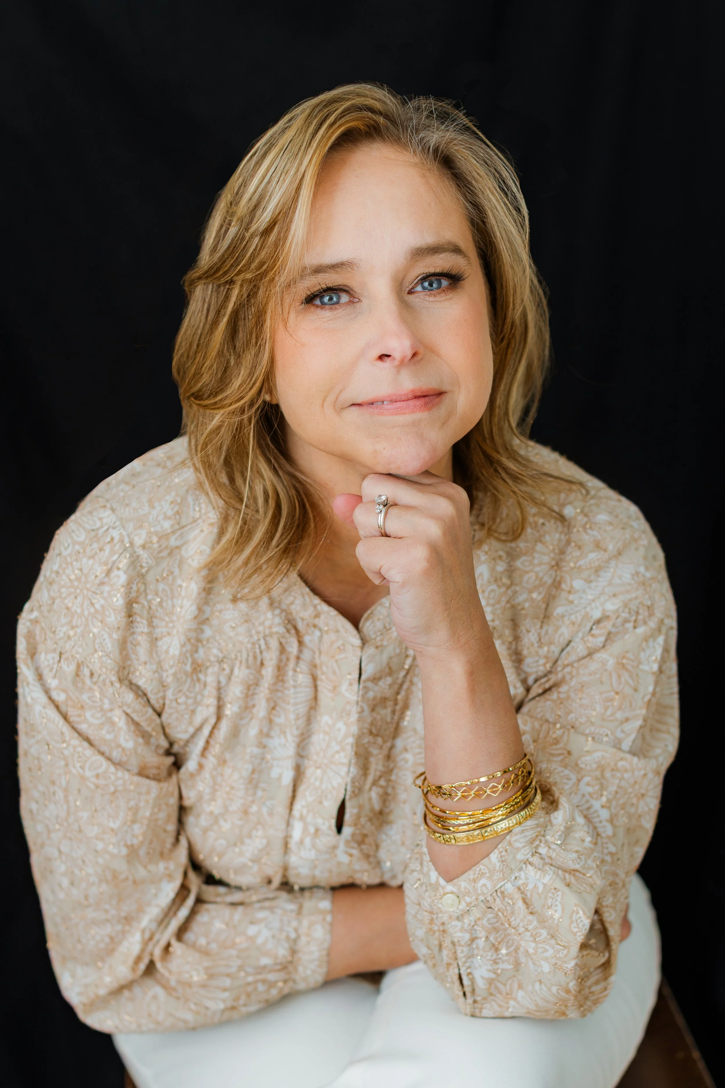  Warm professional headshot of a woman in a neutral blouse photographed in my Silver Spring MD studio. 