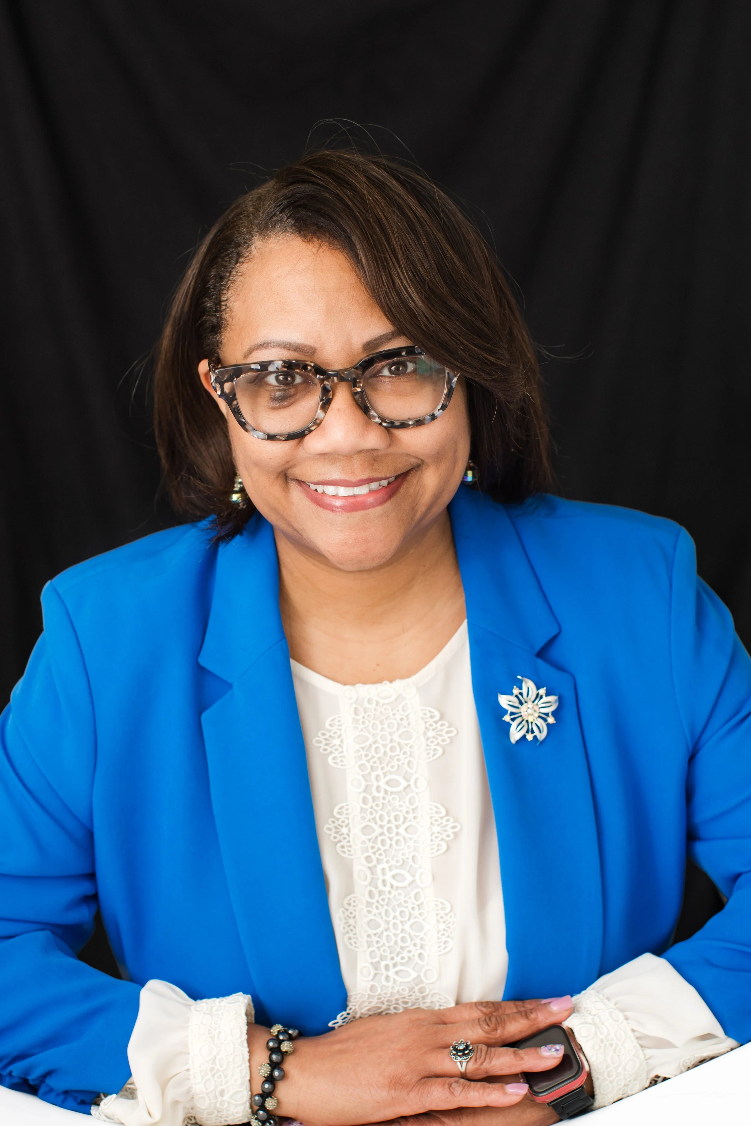  Professional headshot of a woman wearing a bright blue blazer photographed in my Silver Spring MD studio. 