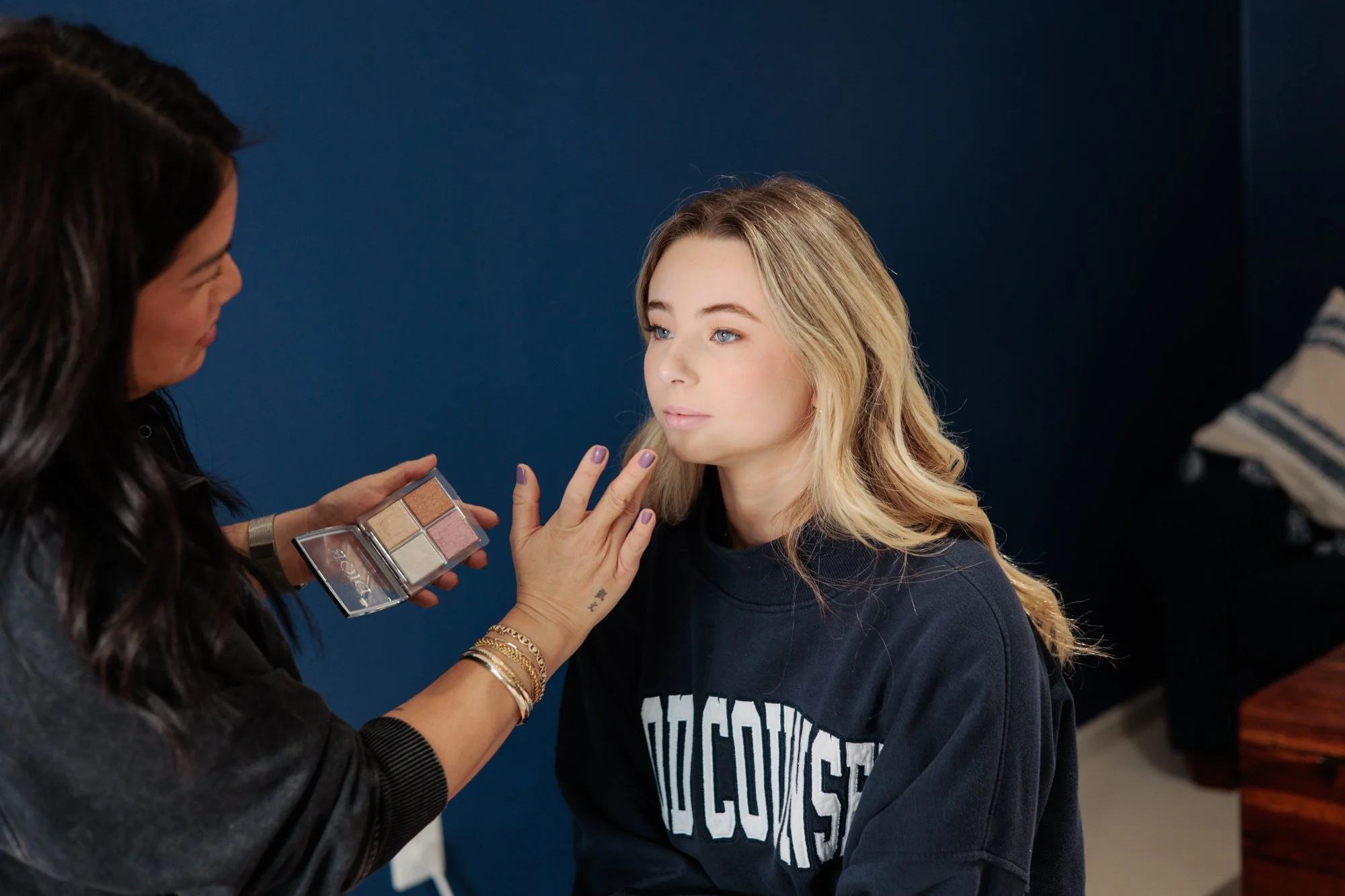  teen daughter getting makeup done 