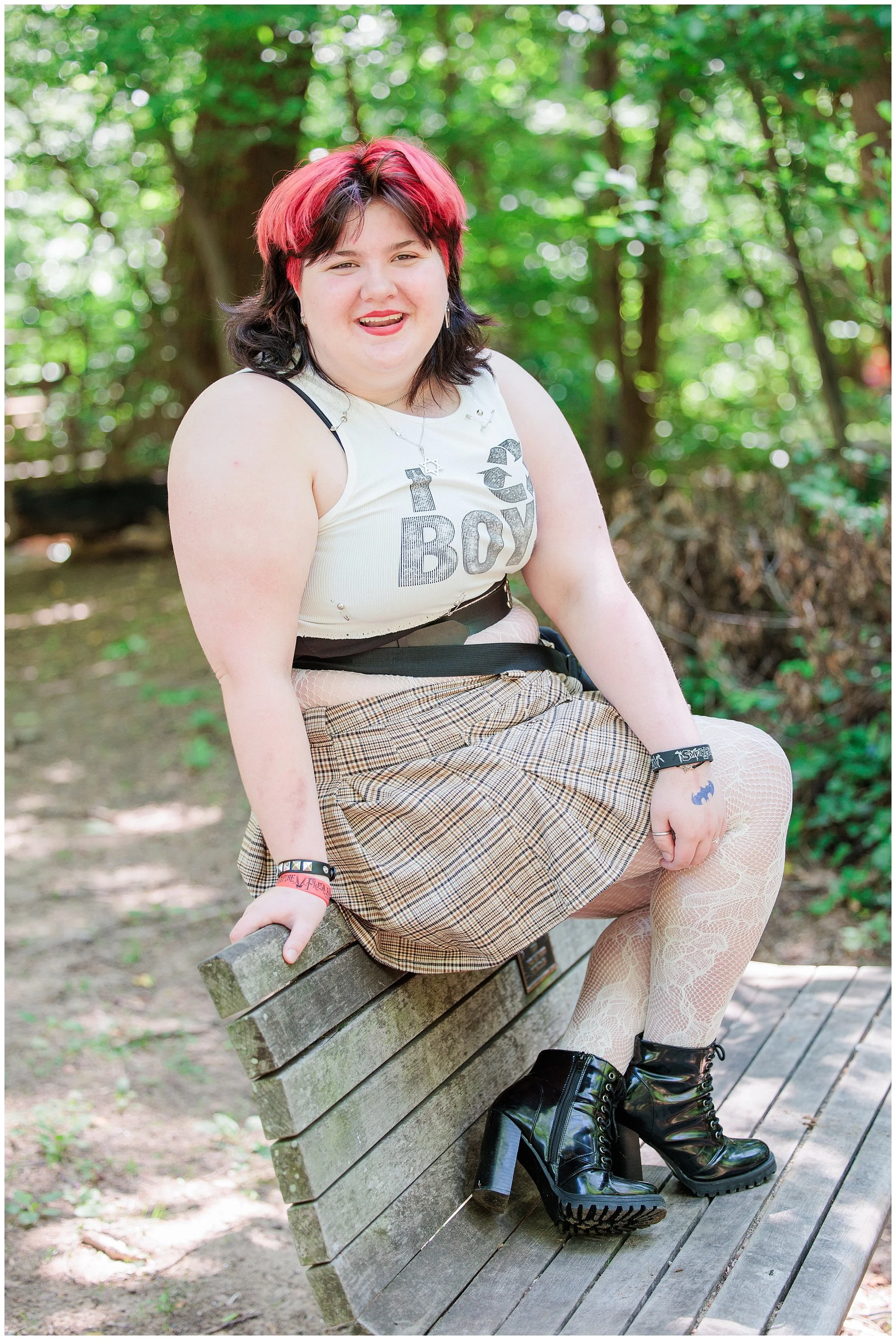  senior girl sitting on bench for photo session in Maryland 