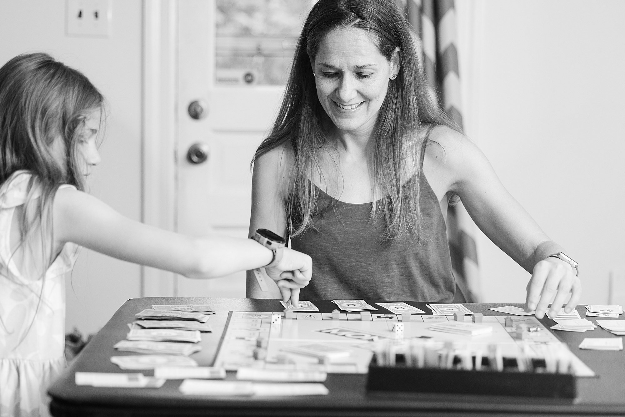  mother and daughter playing monolopy 