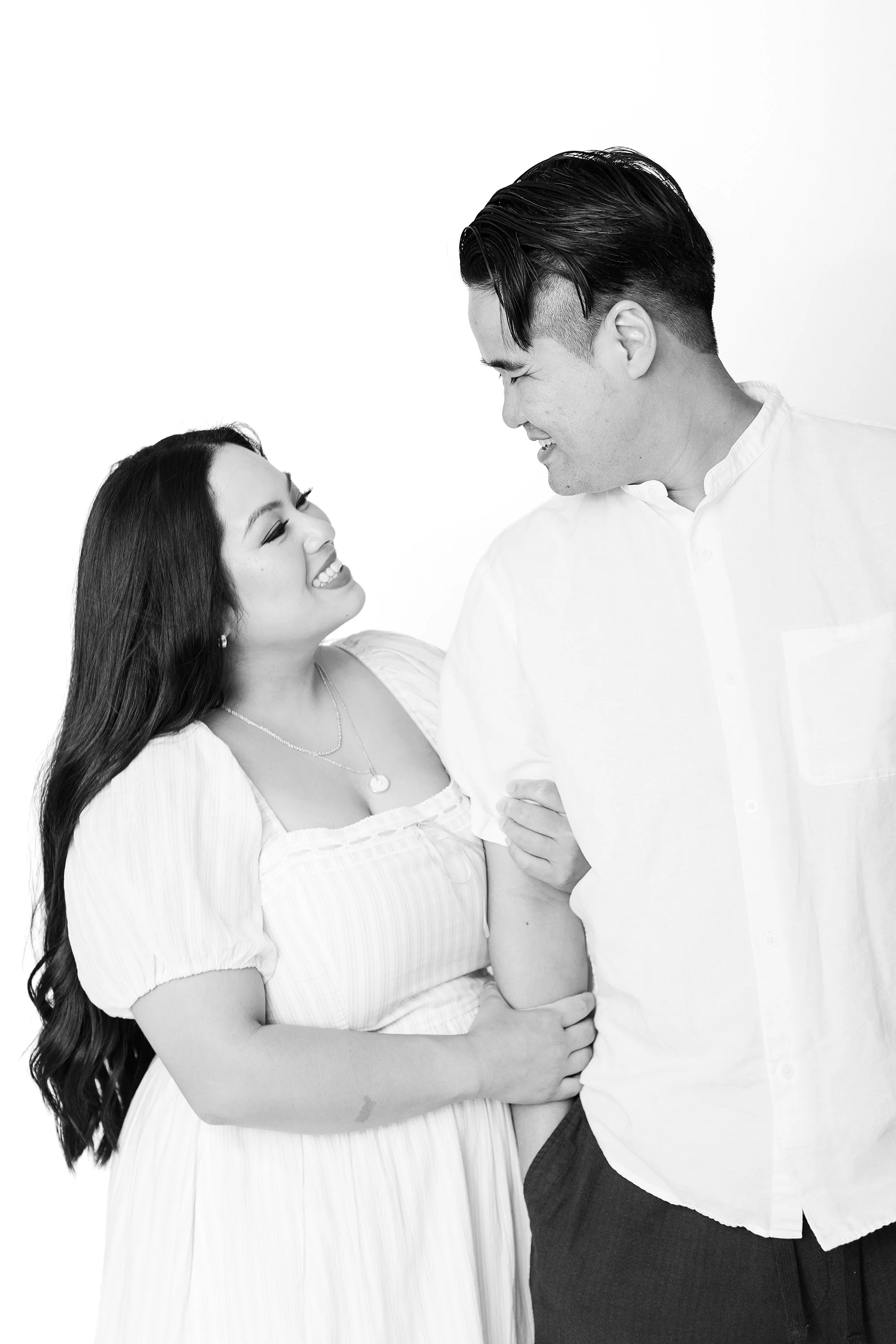 Close-up portrait of husband and wife smiling together