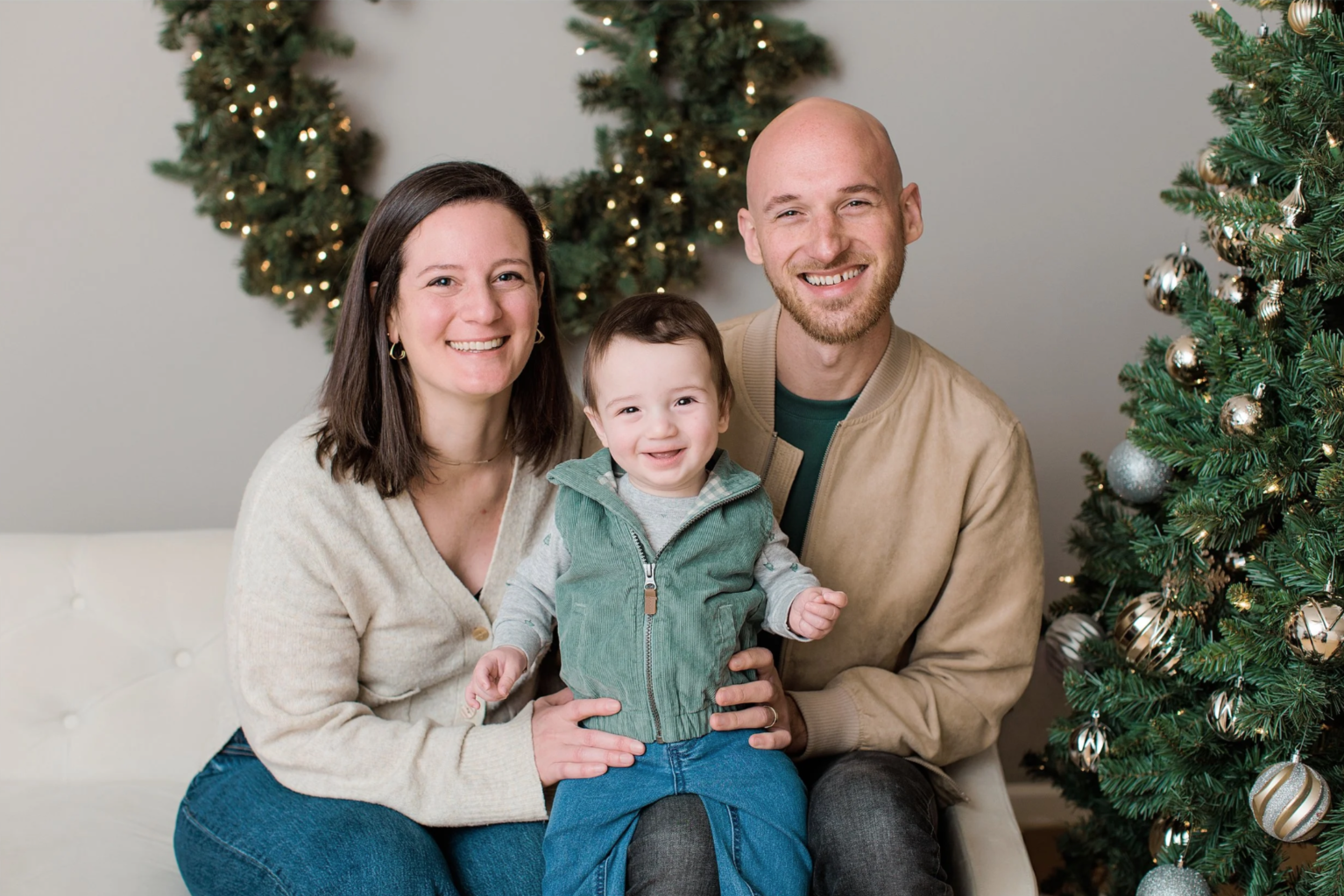 family smiling for camera during Christmas mini session