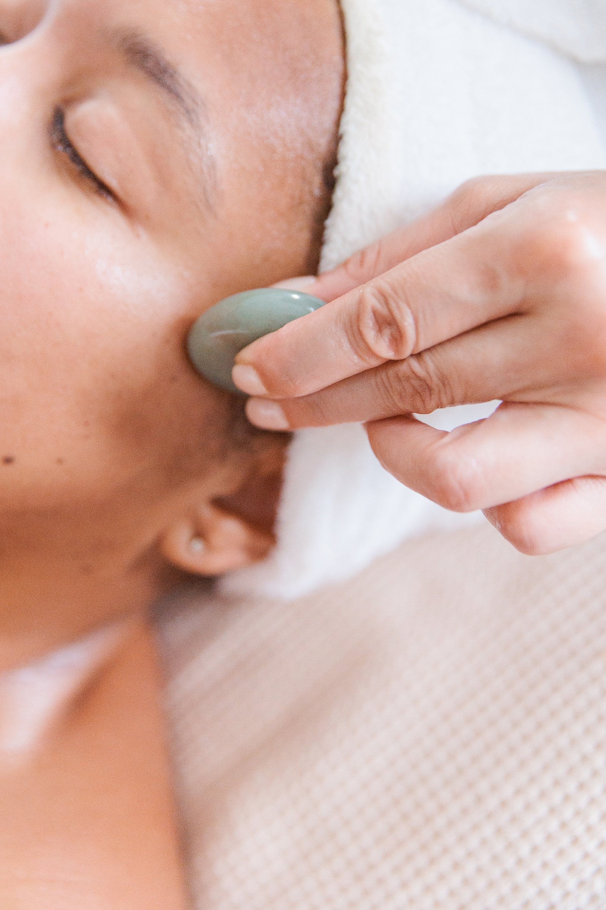 esthetician performing treatment on a client in Maryland