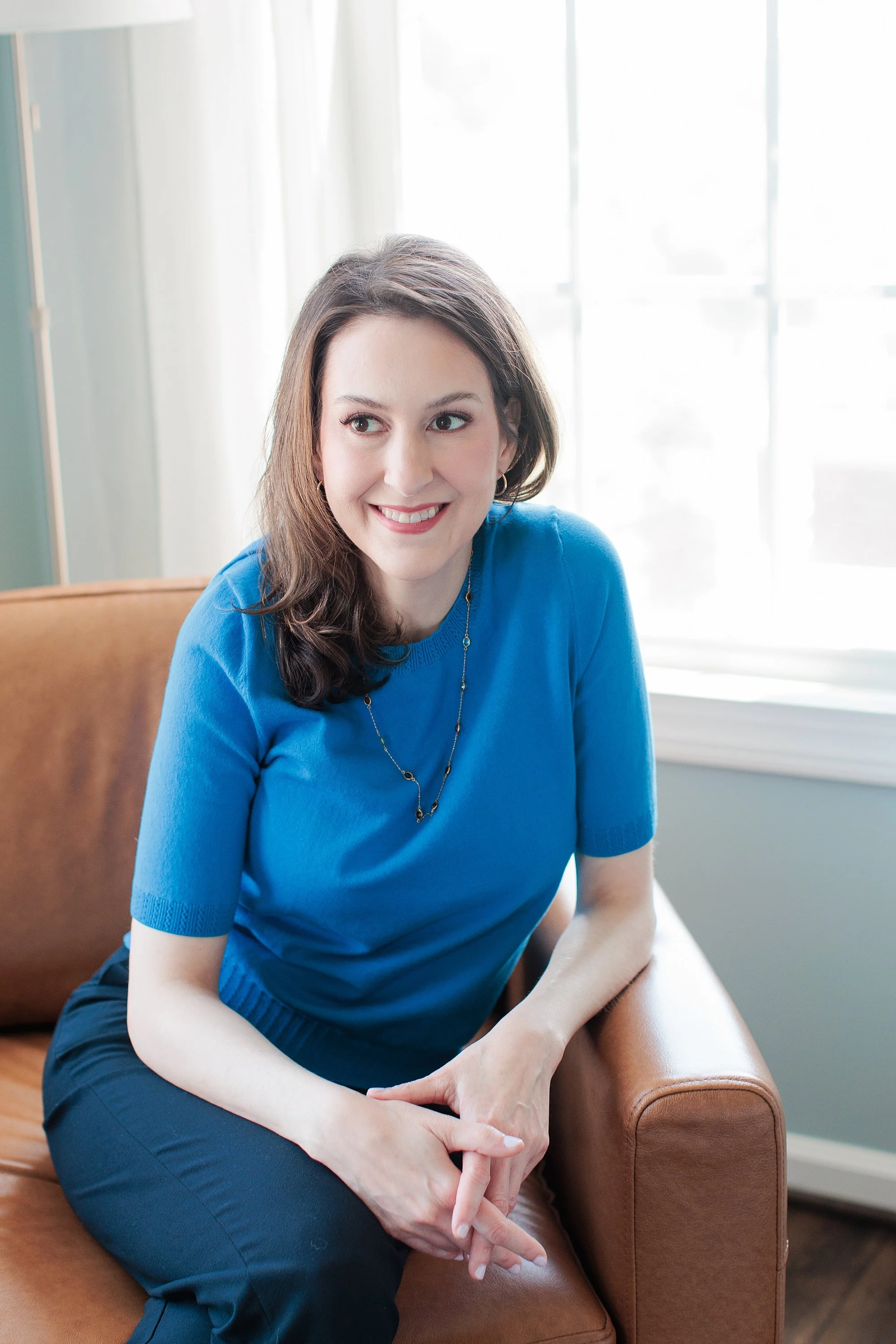 therapist sitting in chair for branding session
