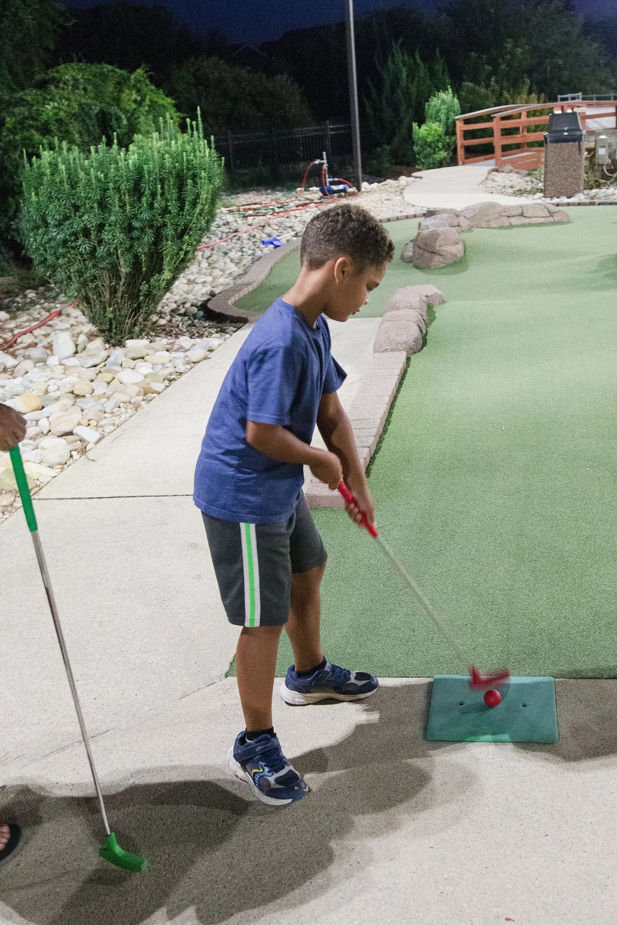 boy playing mini golf in North Carolina