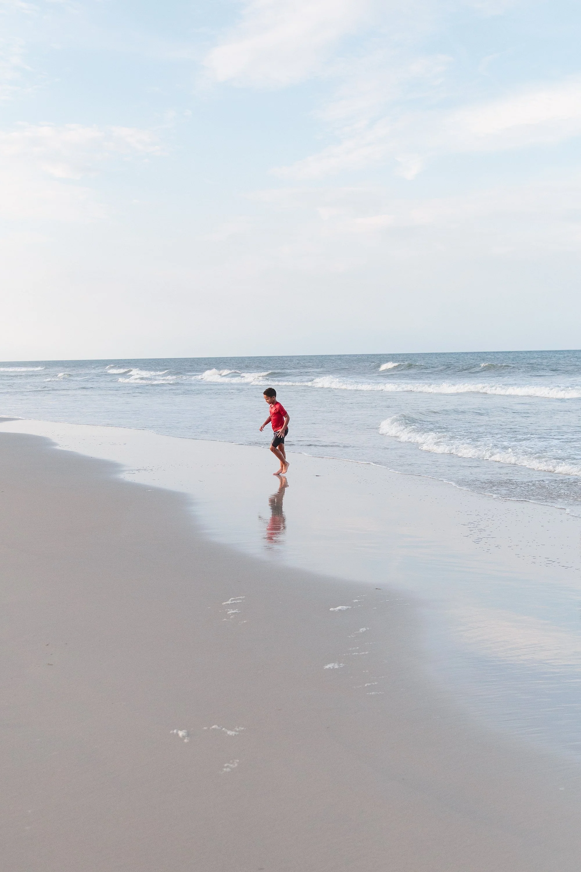 boy in the ocean water in corolla outer banks