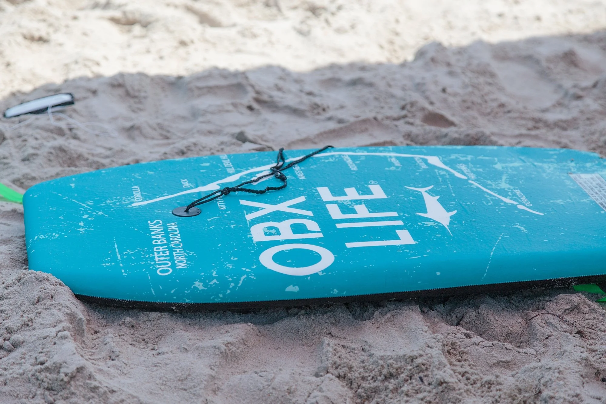 boogie board that says OBX life