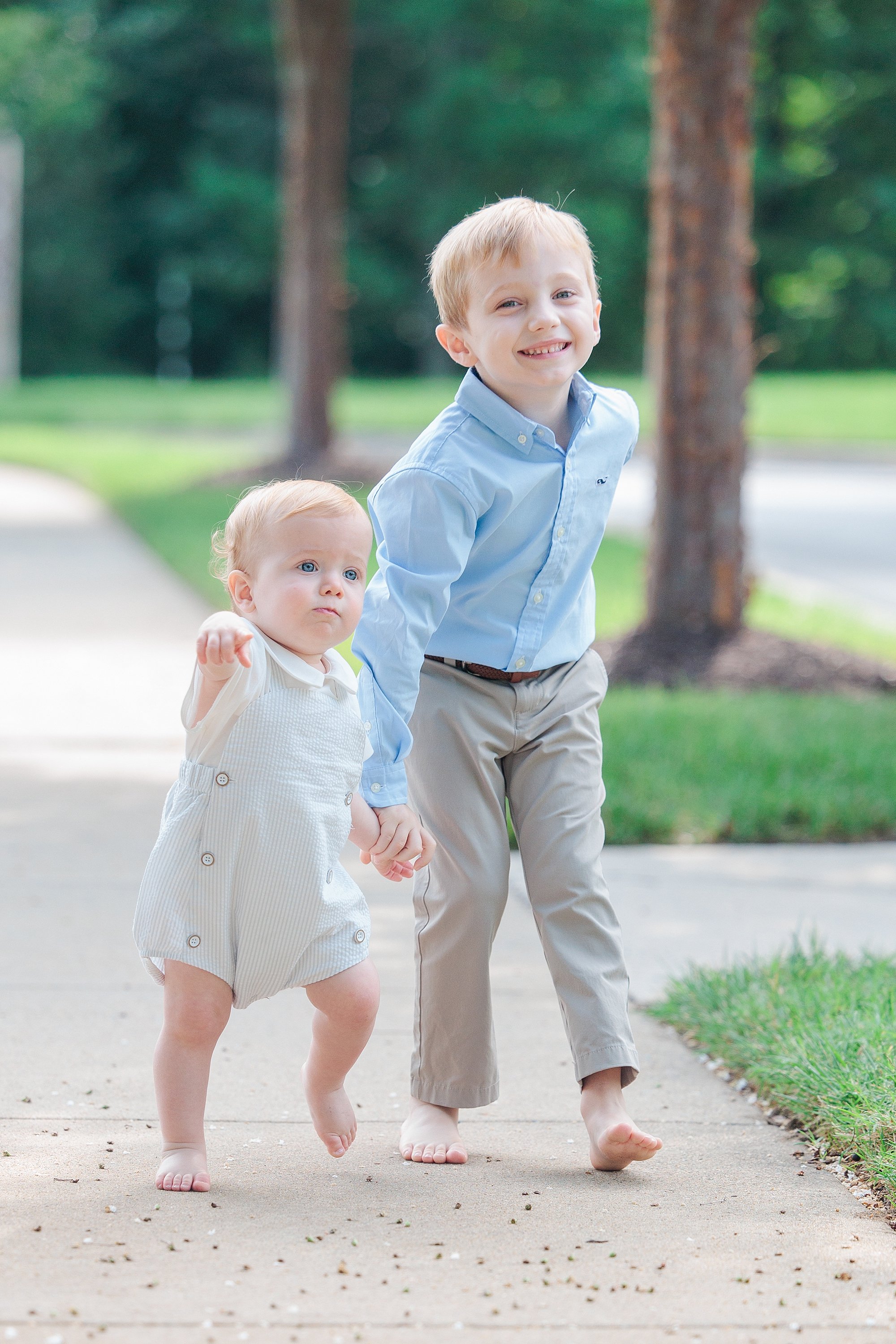 two brothers walking in path during mini session in Maryland