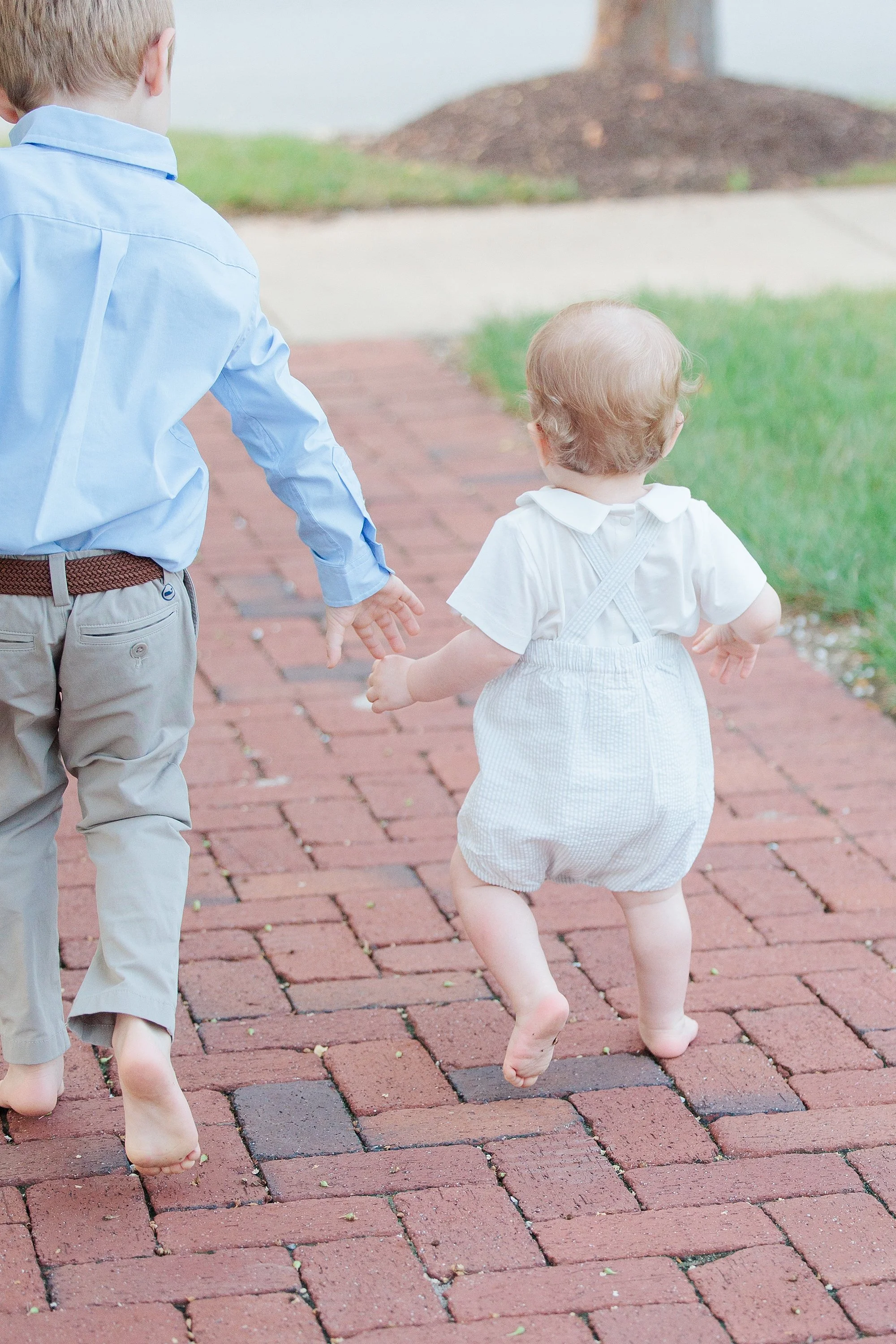 young brothers holding hands during Silver Spring photo shoot