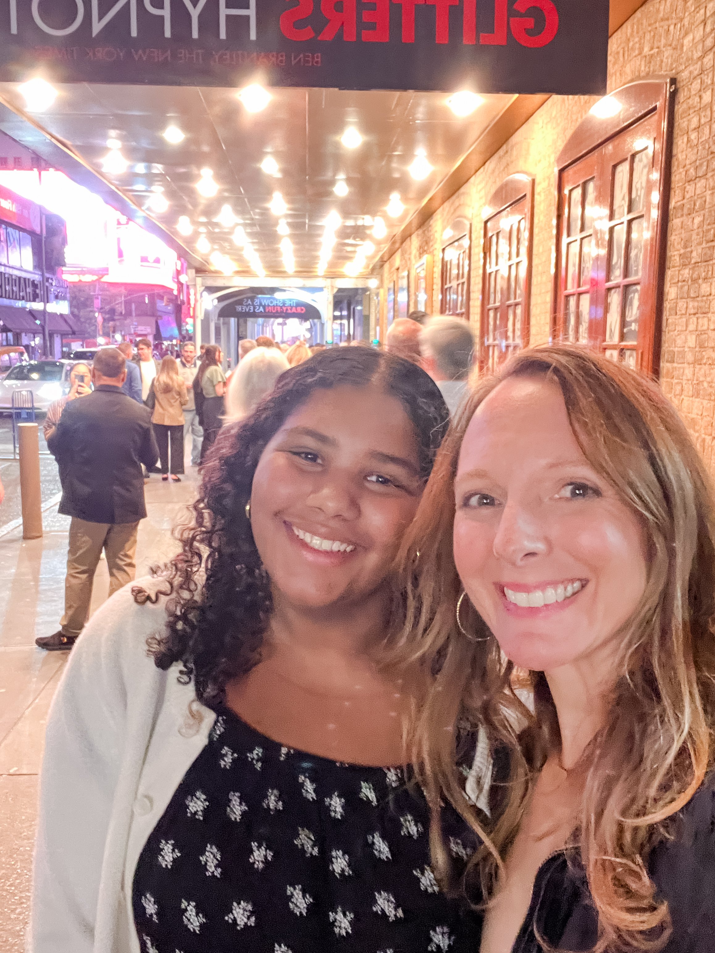 outside theater in NYC with mom and teen