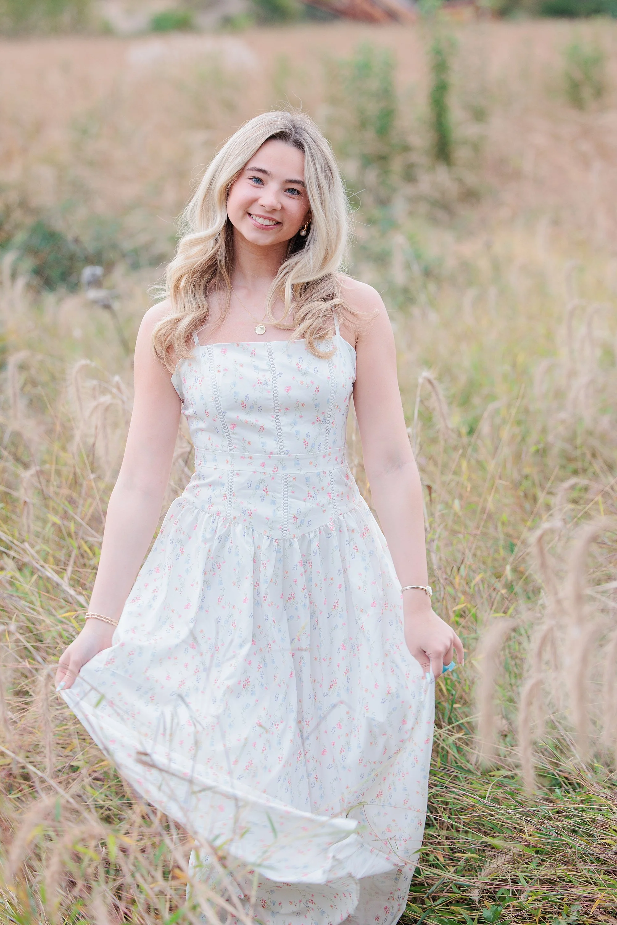 blonde senior girl in long white dress for senior photo session