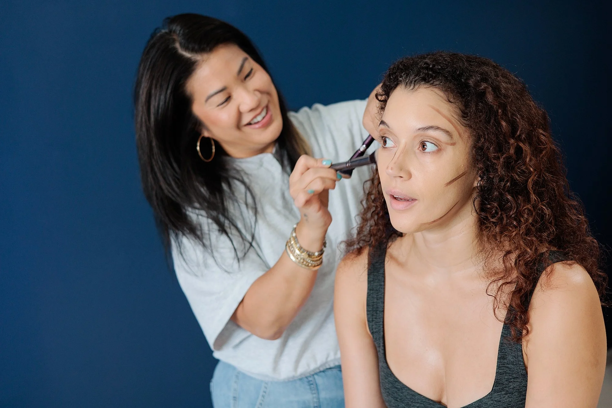 woman getting makeup done for magazine photoshoot in Silver Spring MD