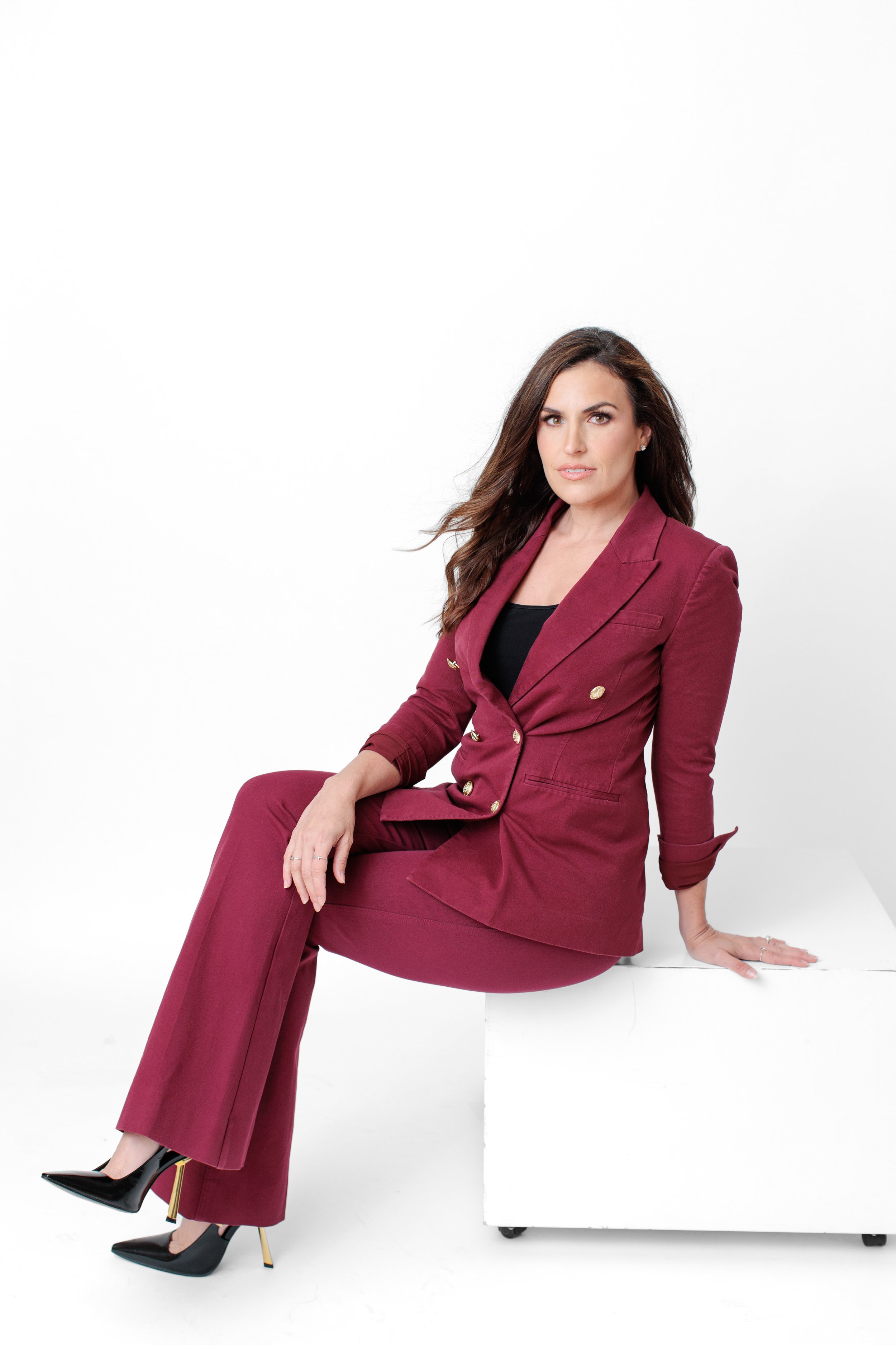 female business owner in maroon suit in silver spring md studio