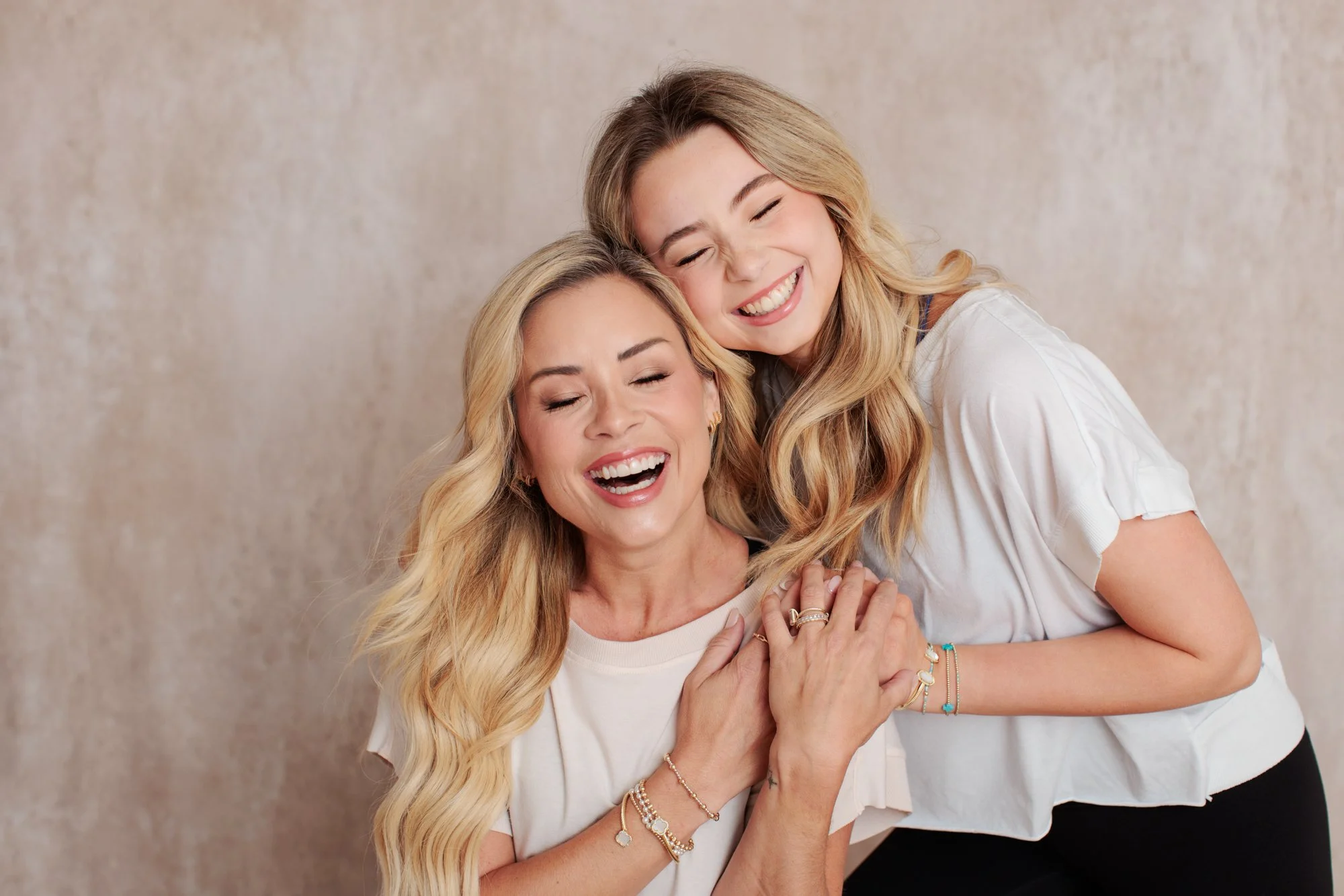mother and daughter laughing and hugging at silver spring studio session