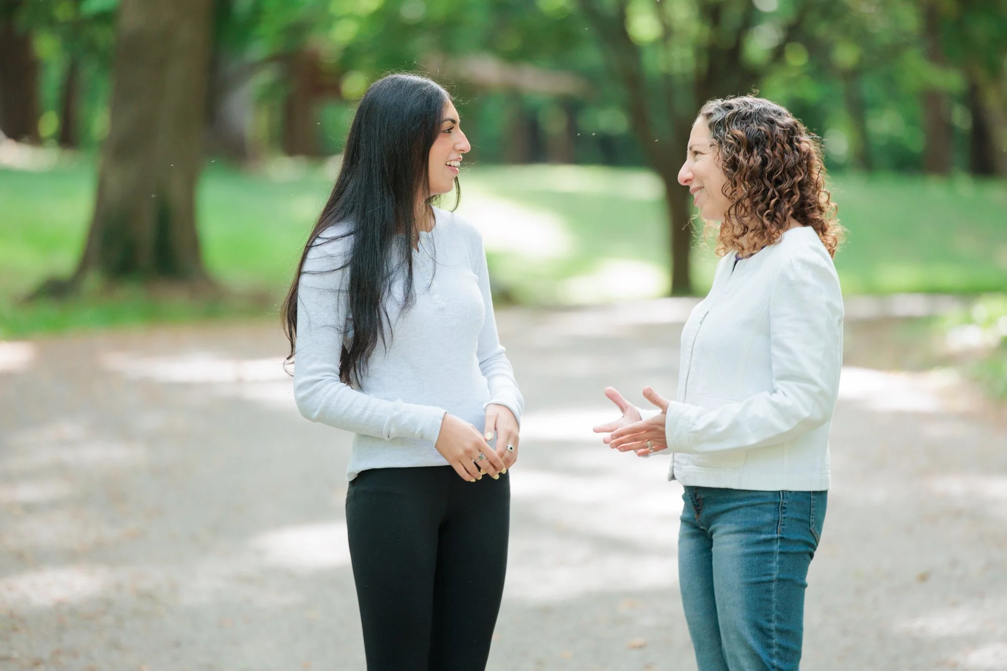 therapist talking to a client in a park in maryland for branding session