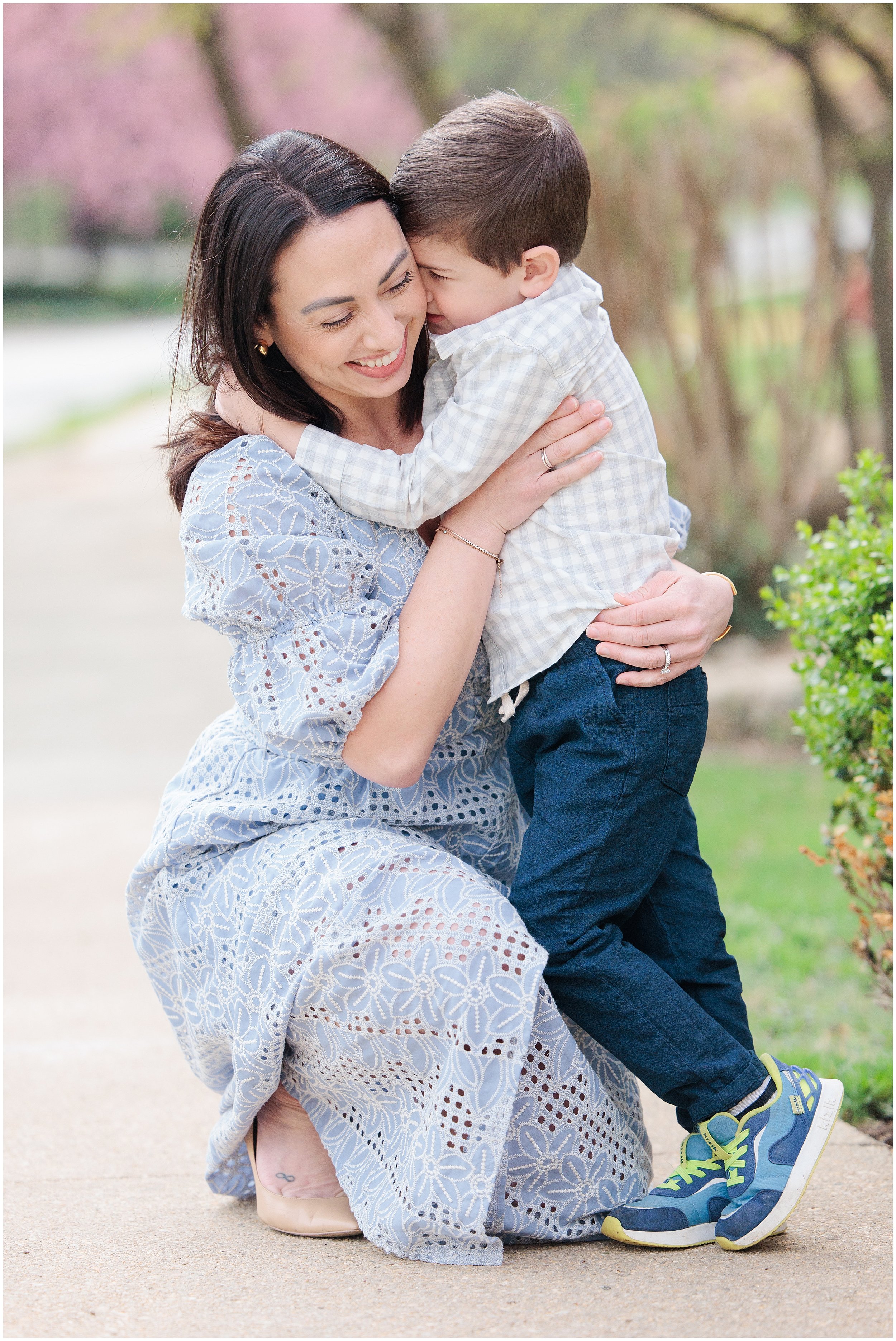mom hugging her son in the spring in Kensington MD