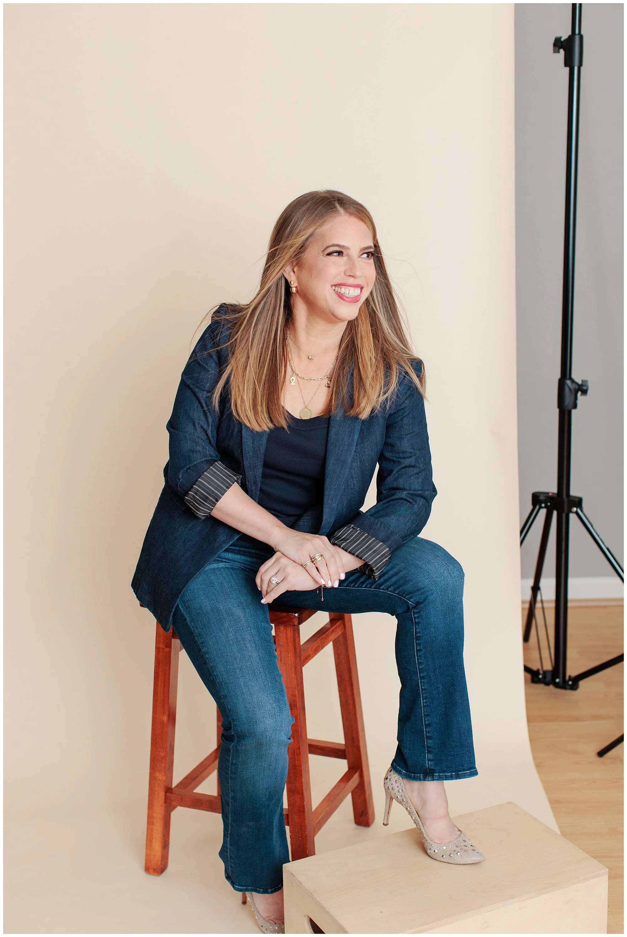 modern headshot of woman against cream backdrop in Silver Spring maryland studio