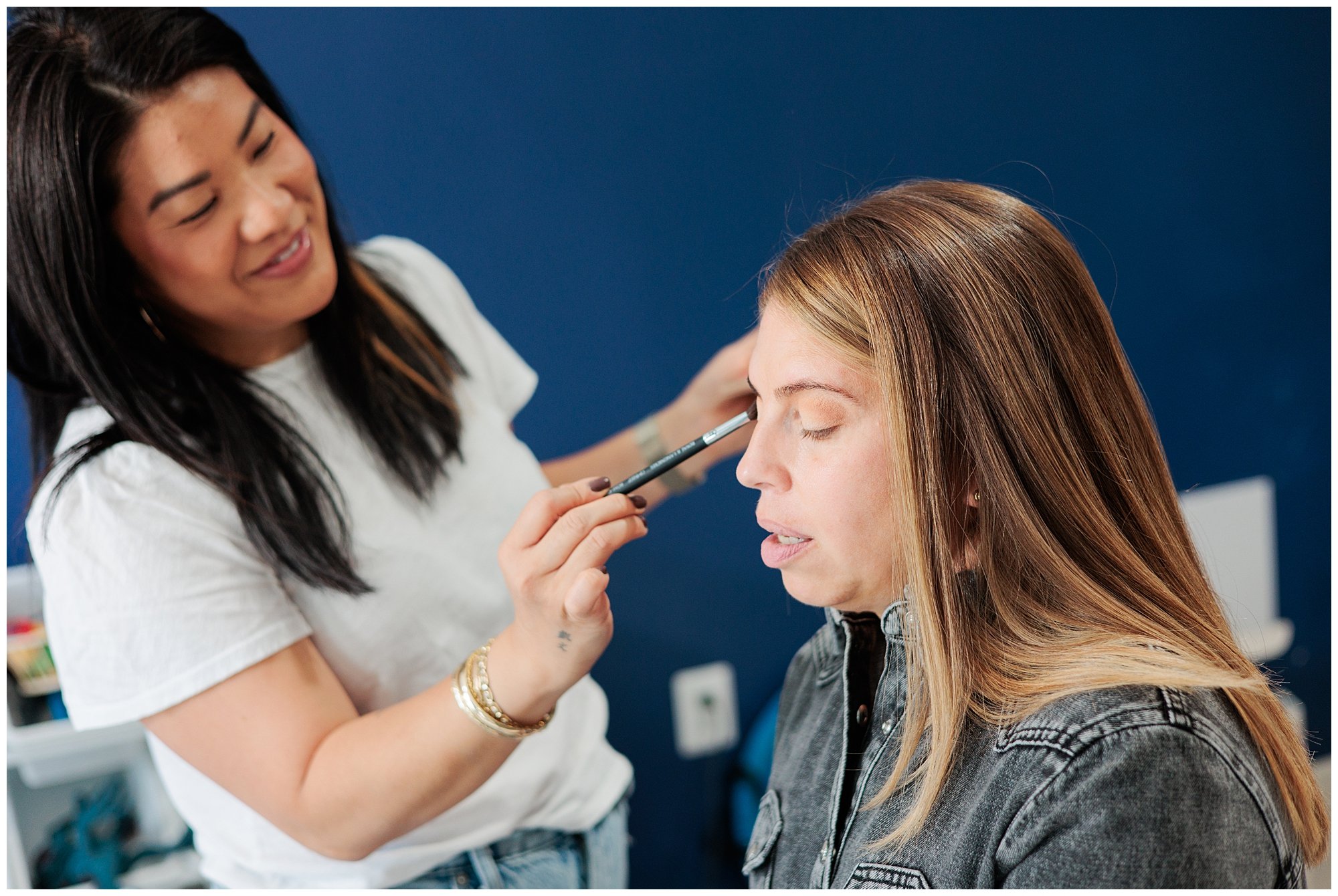 woman getting hair and makeup done in silver spring studio