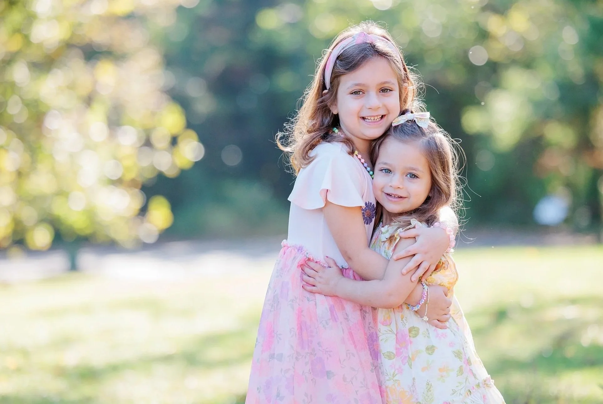 girls smiling during morning fall family photo session