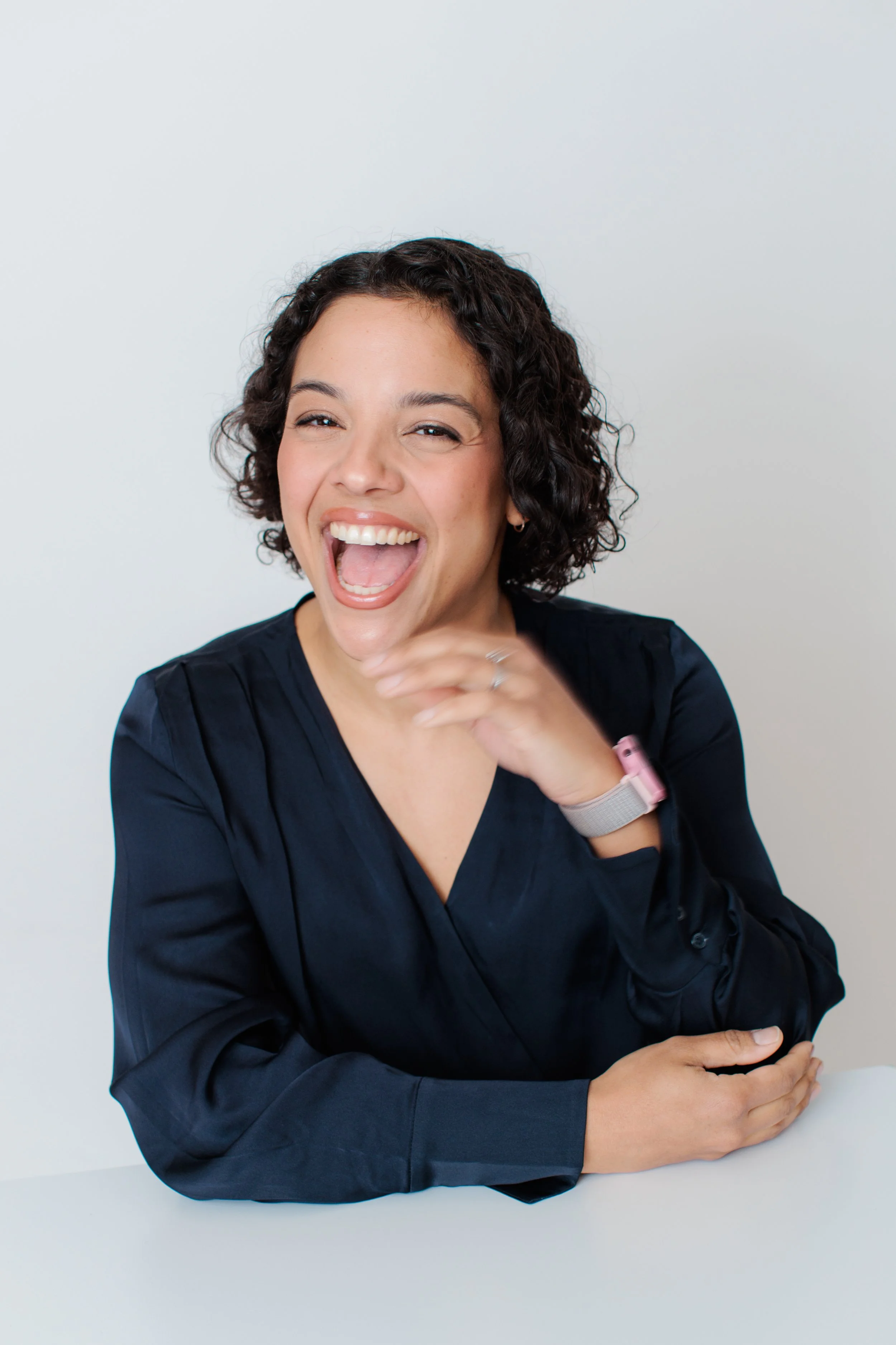 female laughing at camera during headshot session