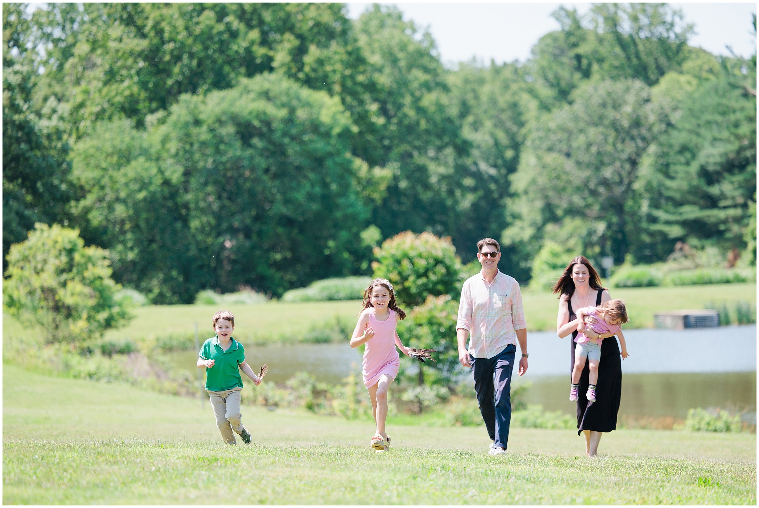 family running in field for maryland family photo session