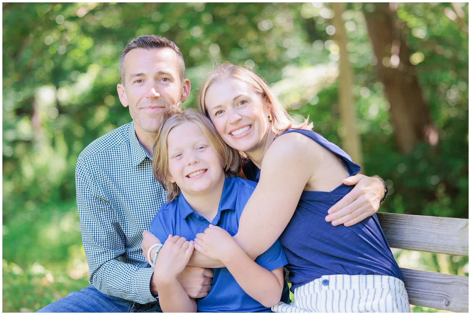 Parents and son laughing together during a spring photo session