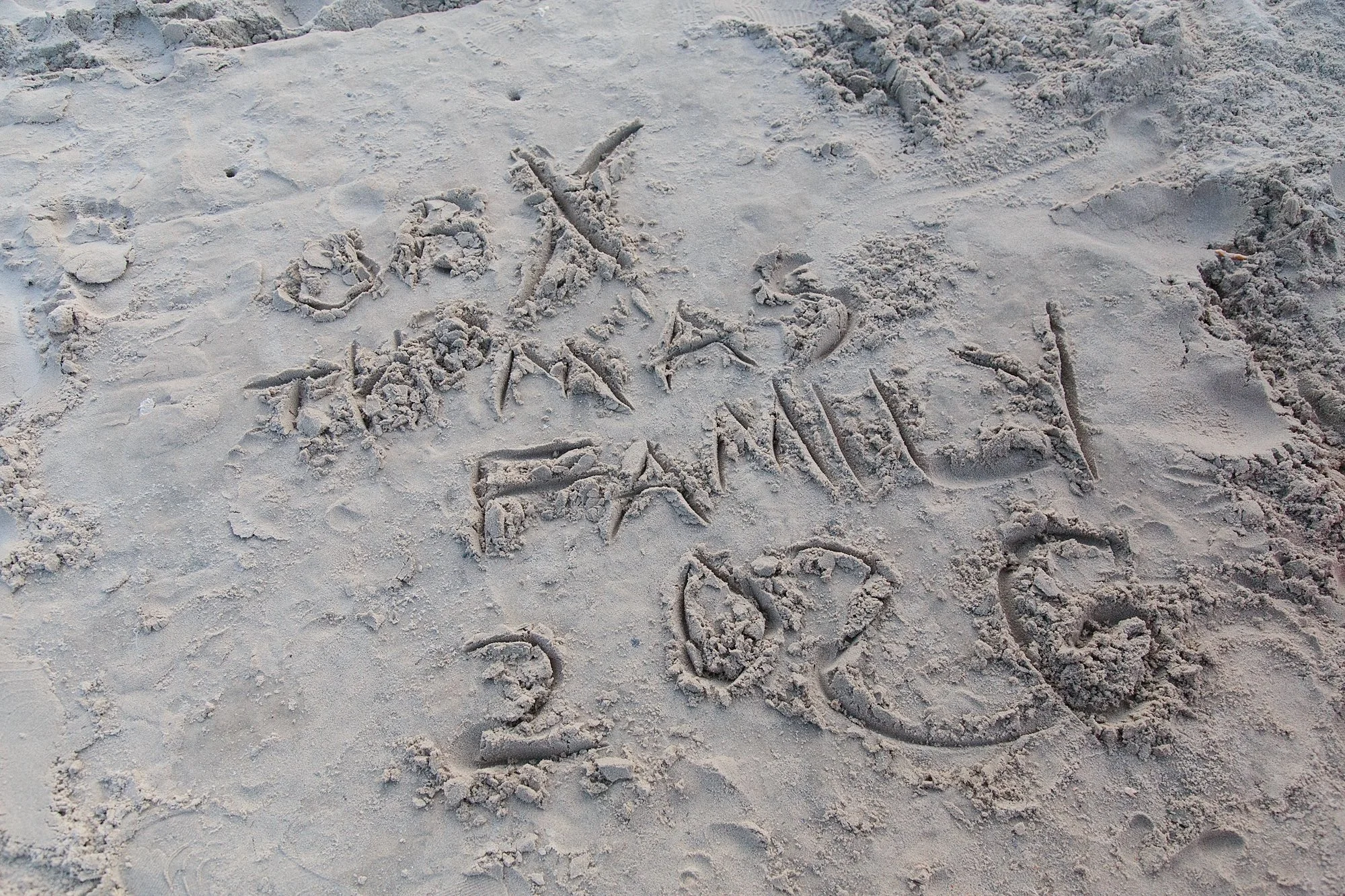 writing in sand in Outer Banks NC