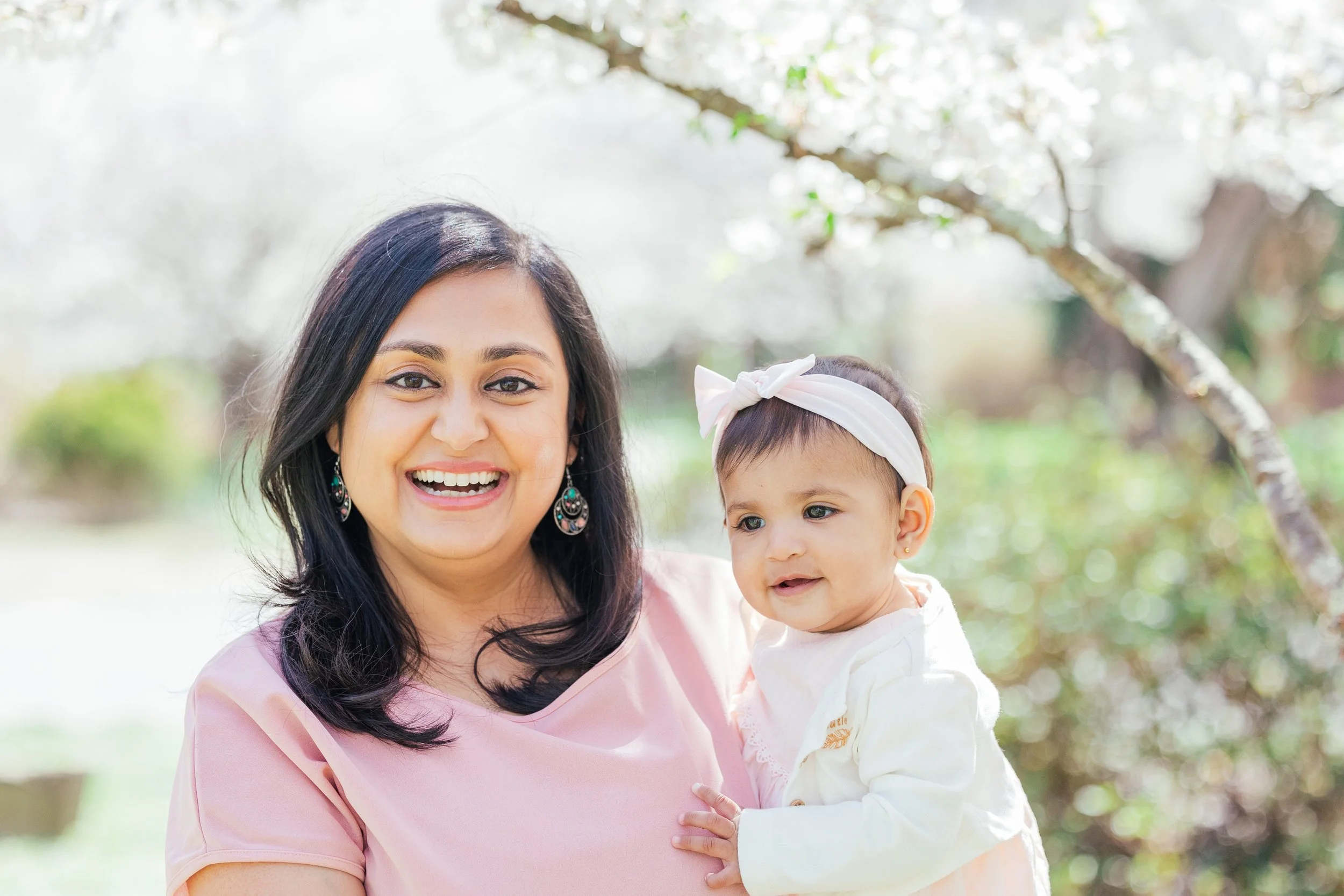 mom and daughter in Kenwood neighborhood MD during cherry blossoms