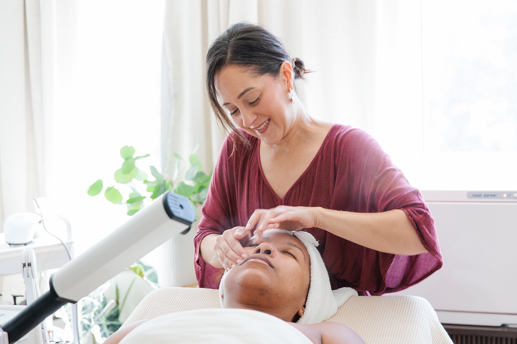 Client relaxing during a facial at Skin by Amanda in Bethesda, Maryland.