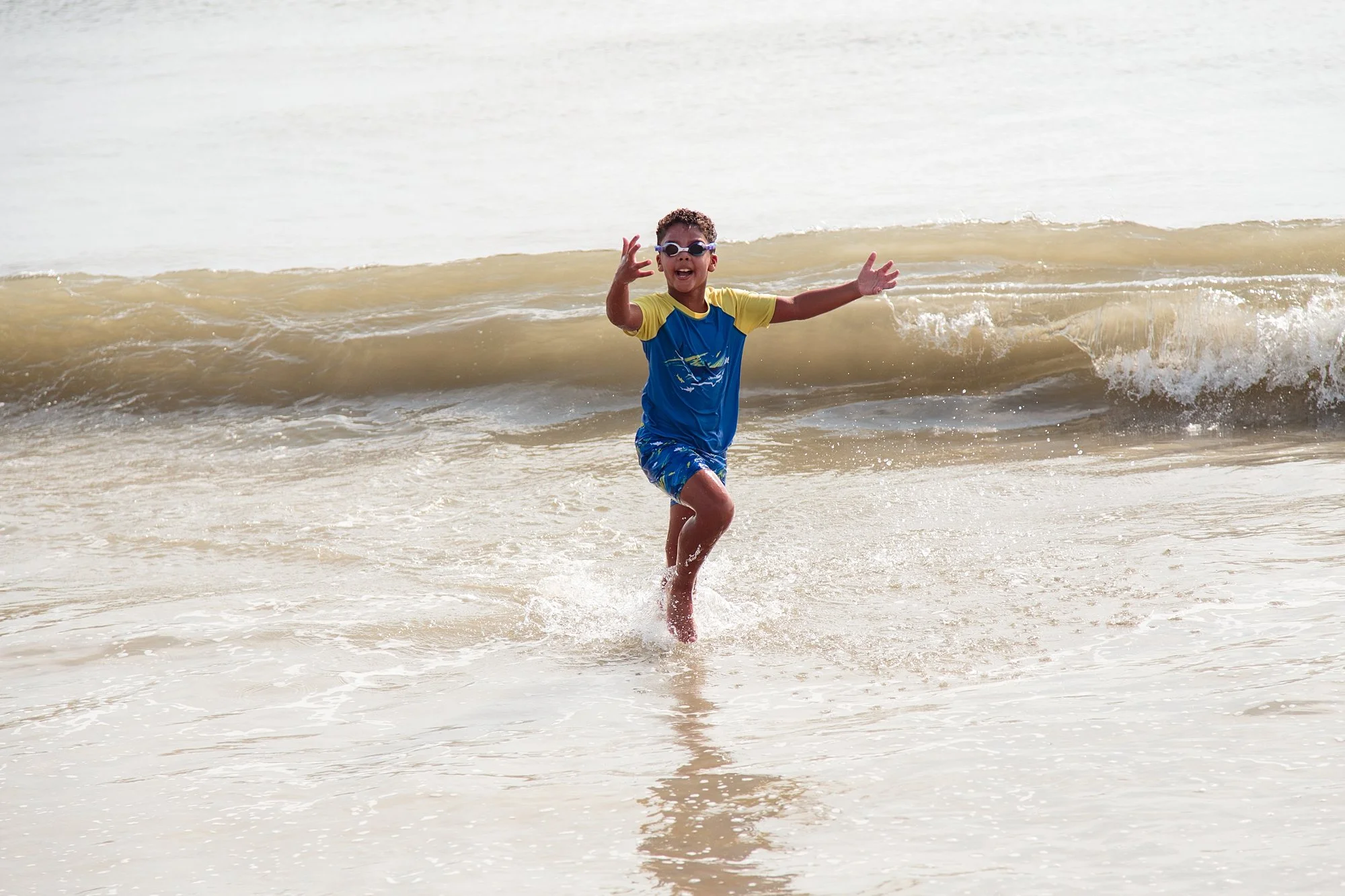 kid in the ocean in Corolla NC