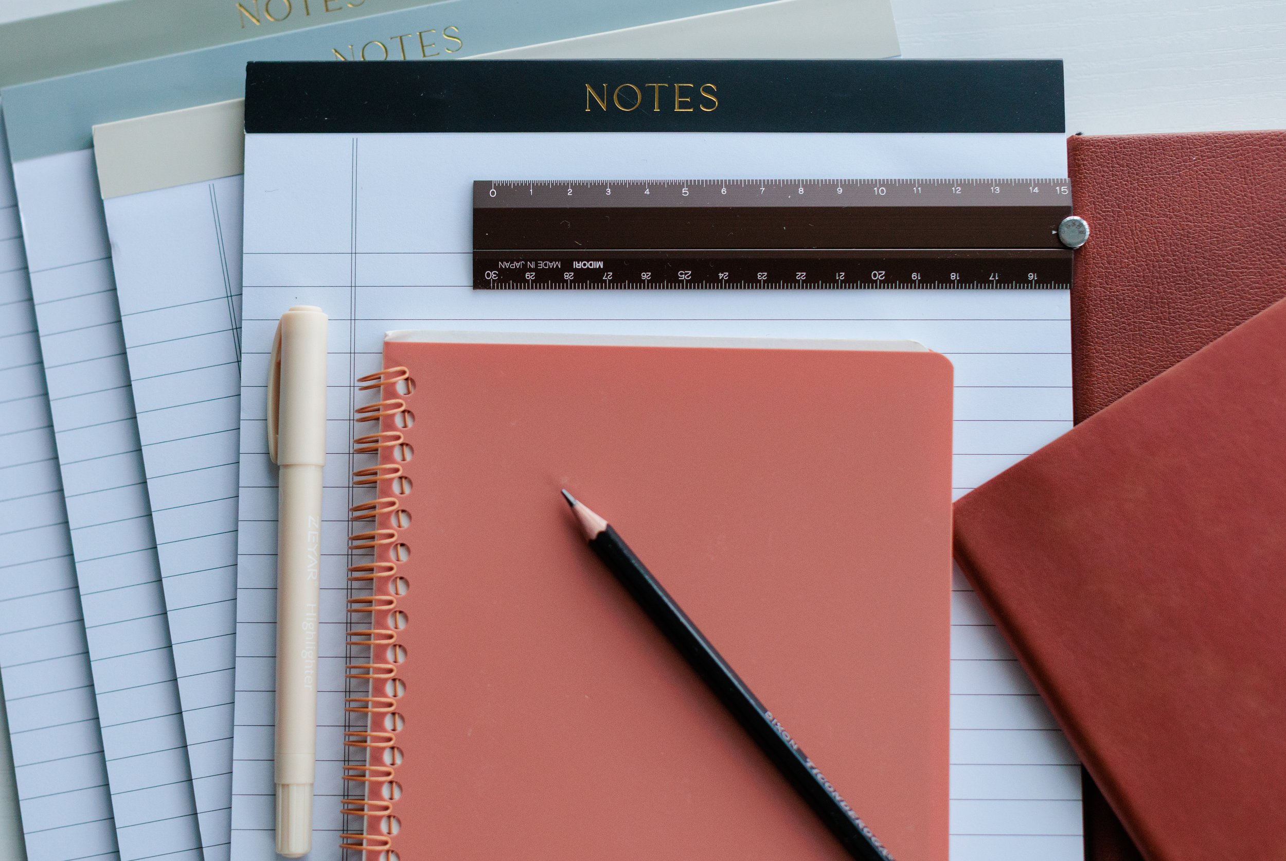 Brand photo of notepads and pencil for law firm