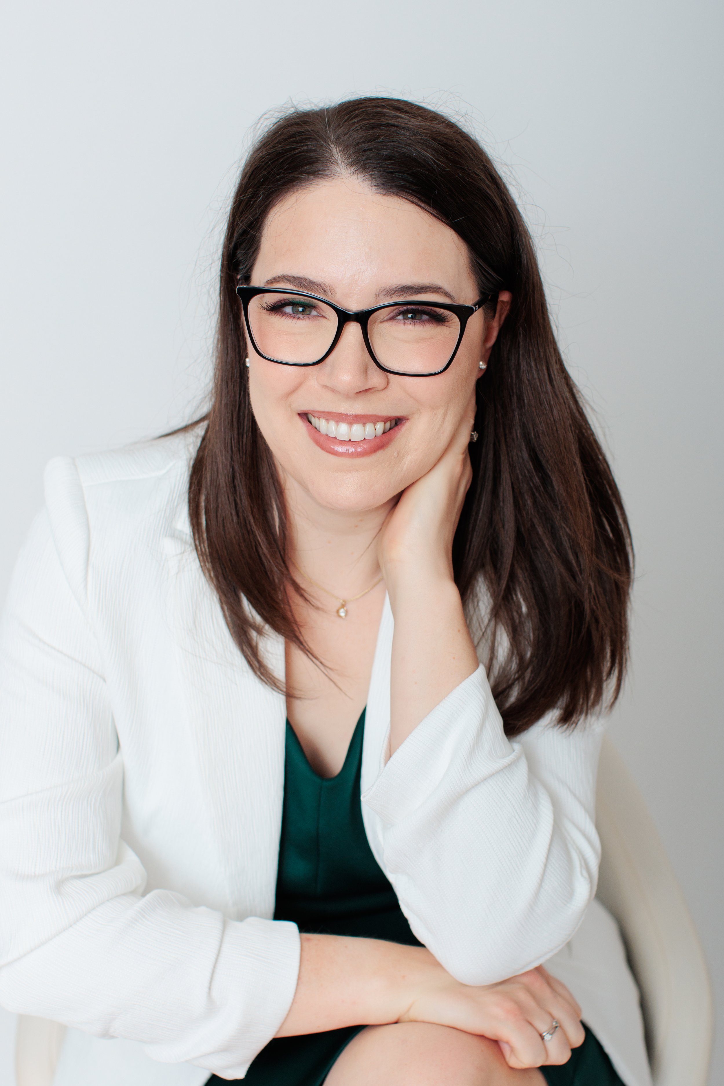 headshot of female professional in silver spring studio wearing white blazer