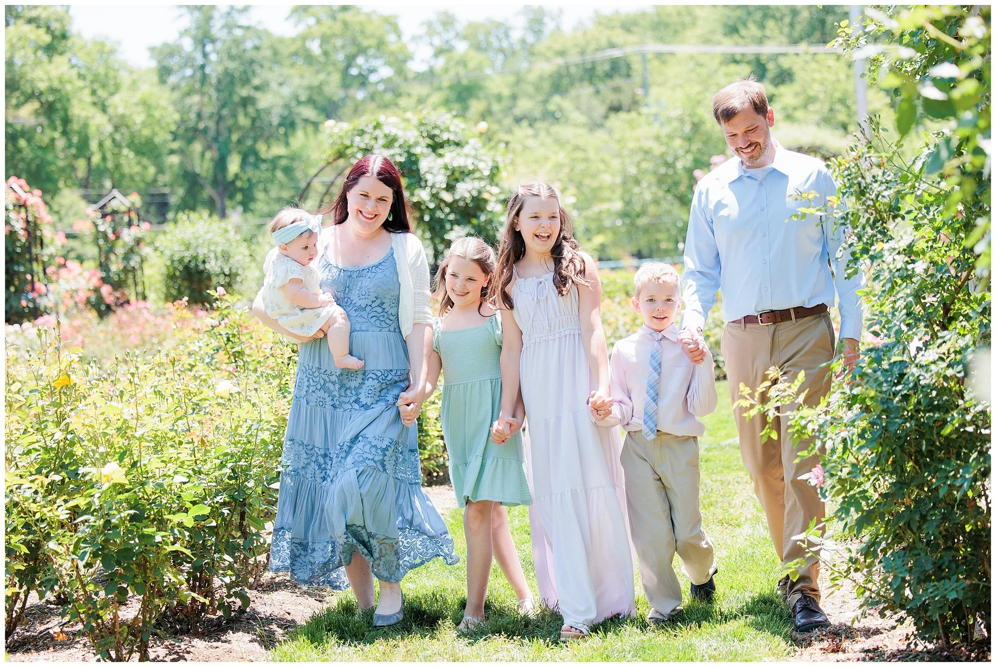Family of six together at Bon Air Rose Garden