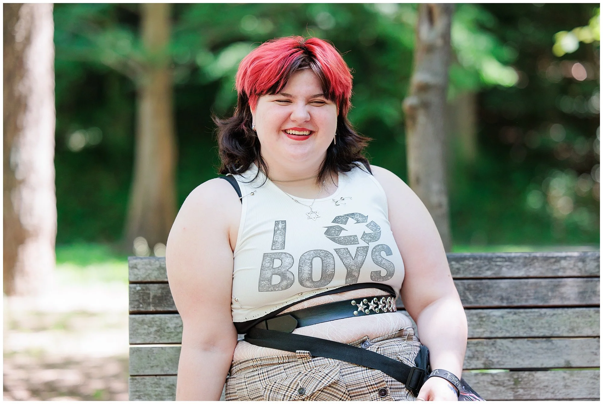senior sitting on bench for senior portrait session with Maryland Senior Photographer