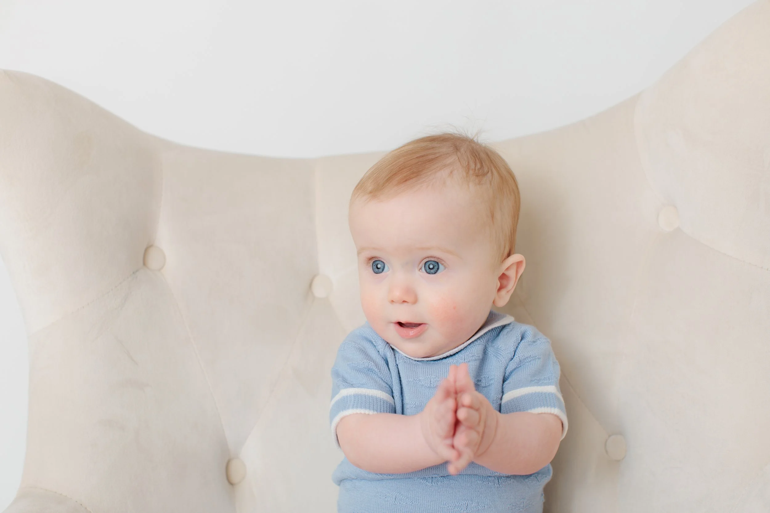 6 month old boy sitting in chair in Silver Spring studio