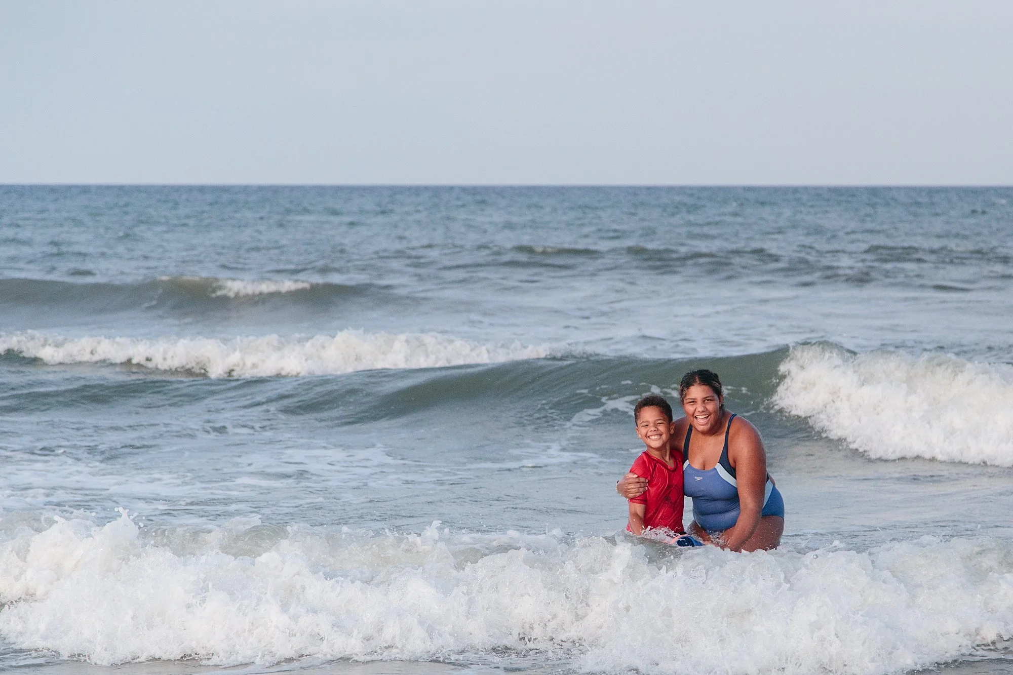 kids smiling in ocean in Corolla NC