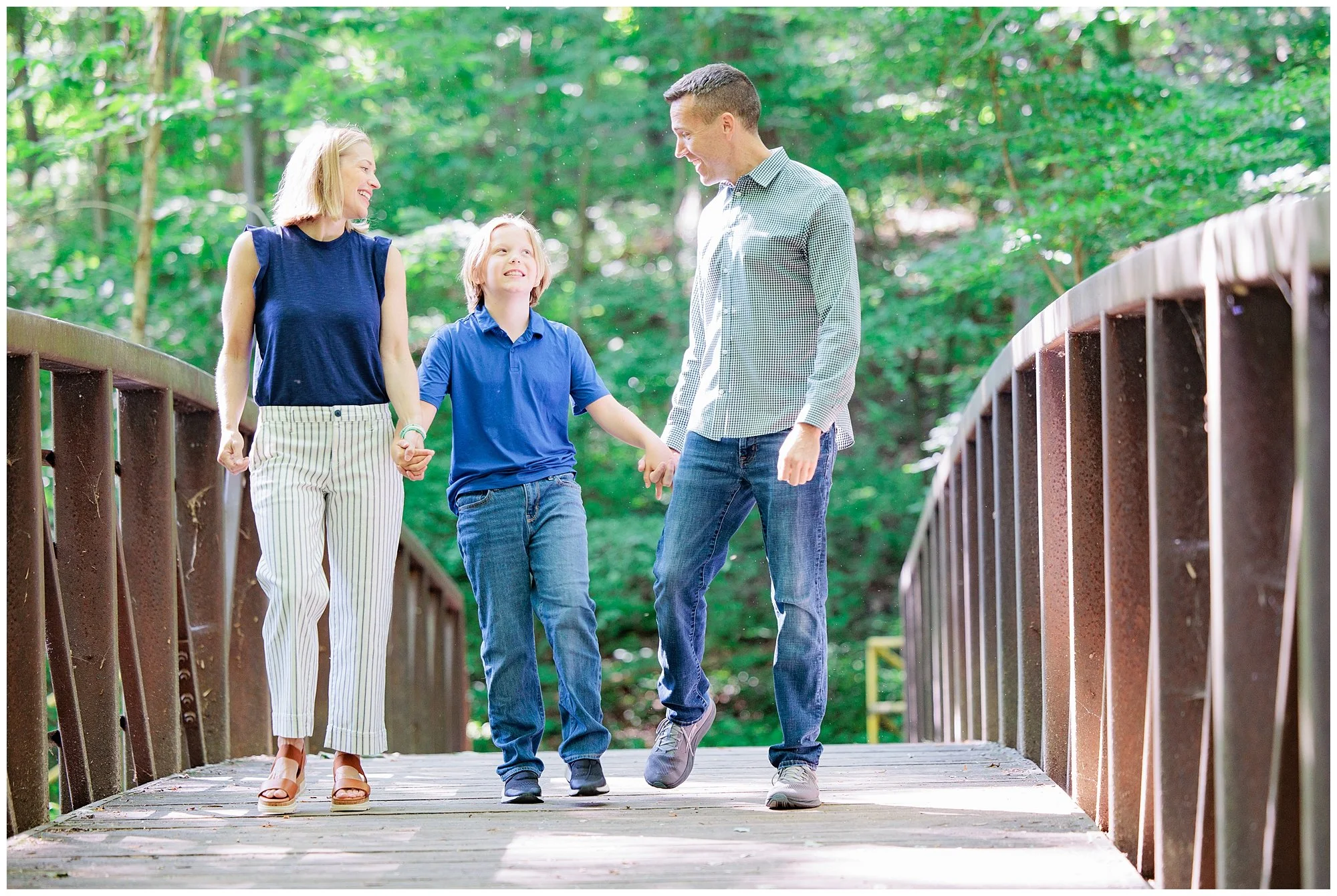 Family walking across a bridge at Valley Mill Park