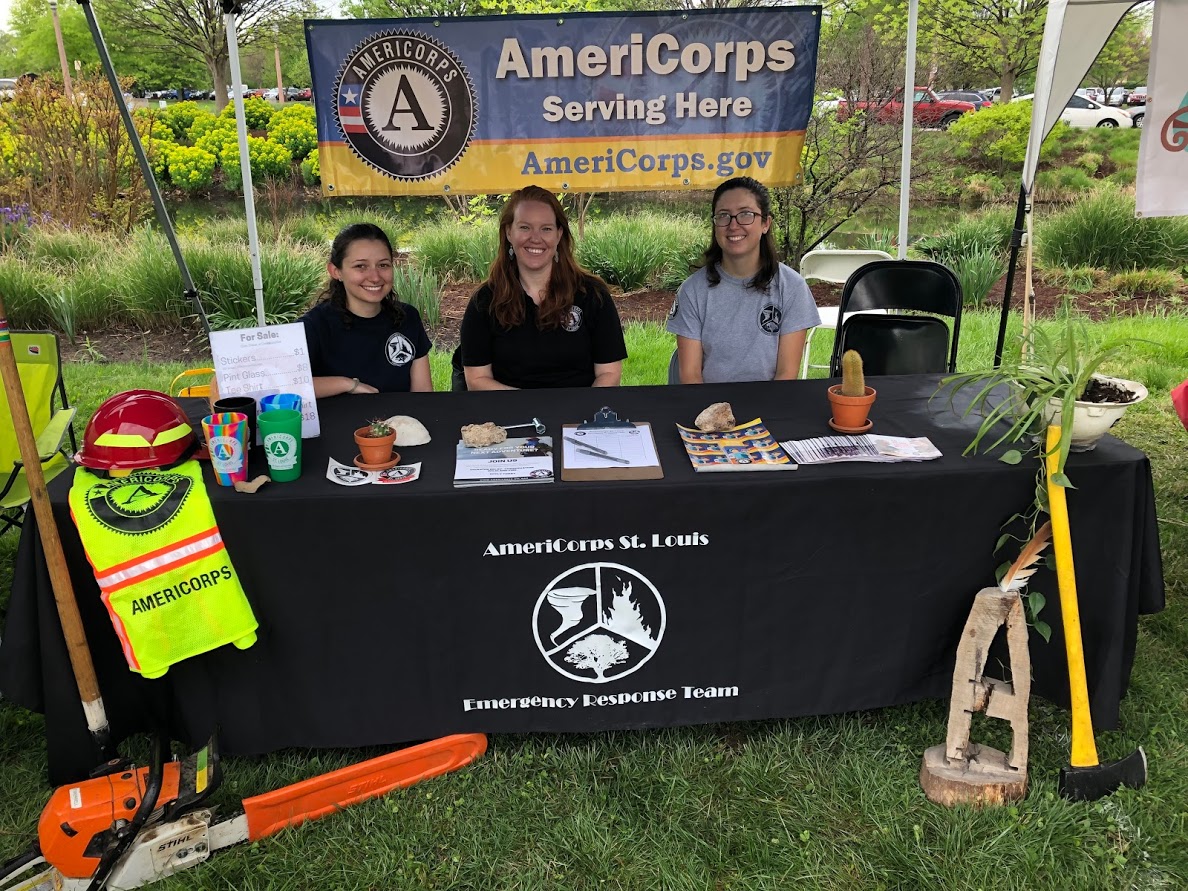 AmeriCorps St. Louis staff and ERT volunteers hanging tight in the rain at the St. Louis Earth Day Festival in May 2019.